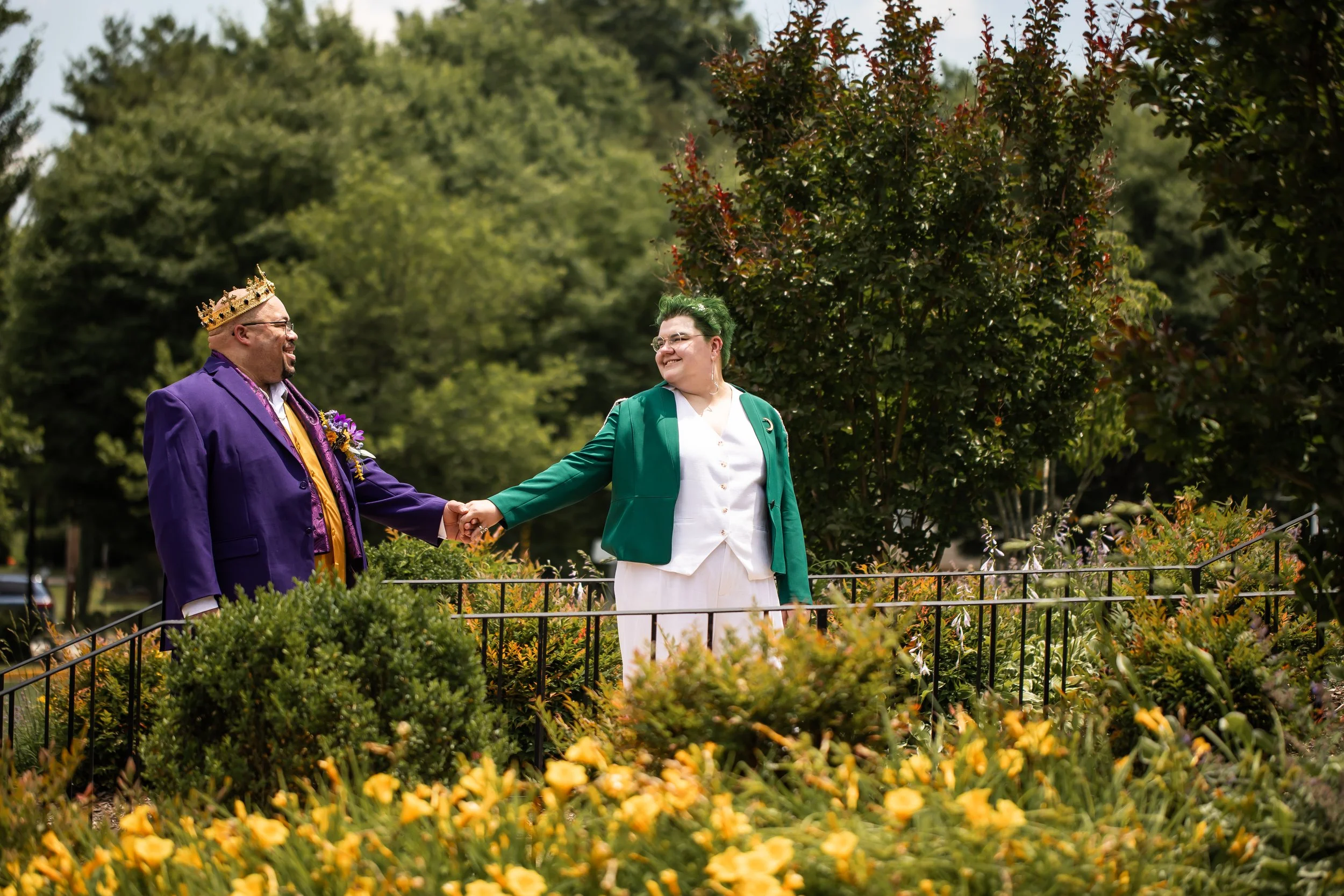non traditional couple walks through flower bridge after eloping virginia north carolina photographer