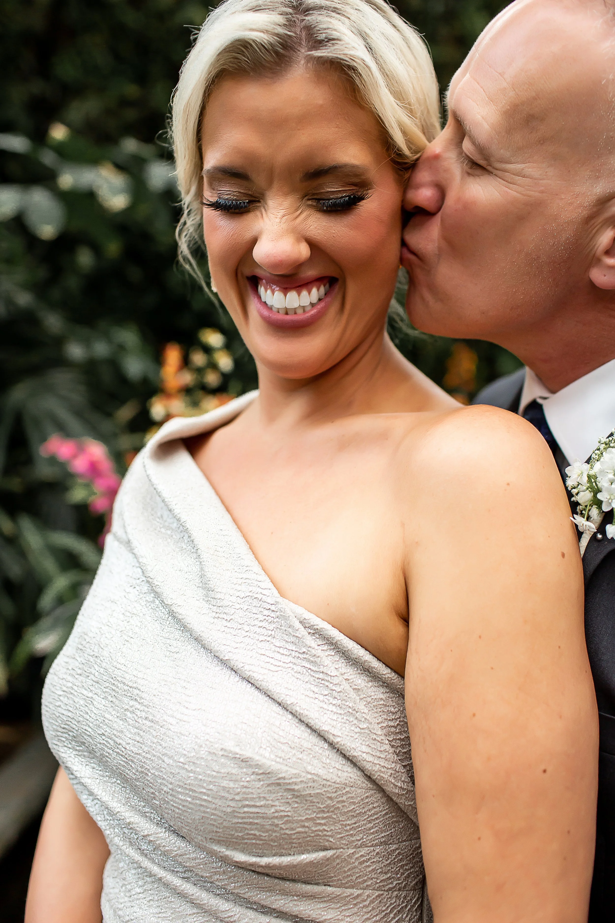 microwedding bride being kissed on the cheek and smiling