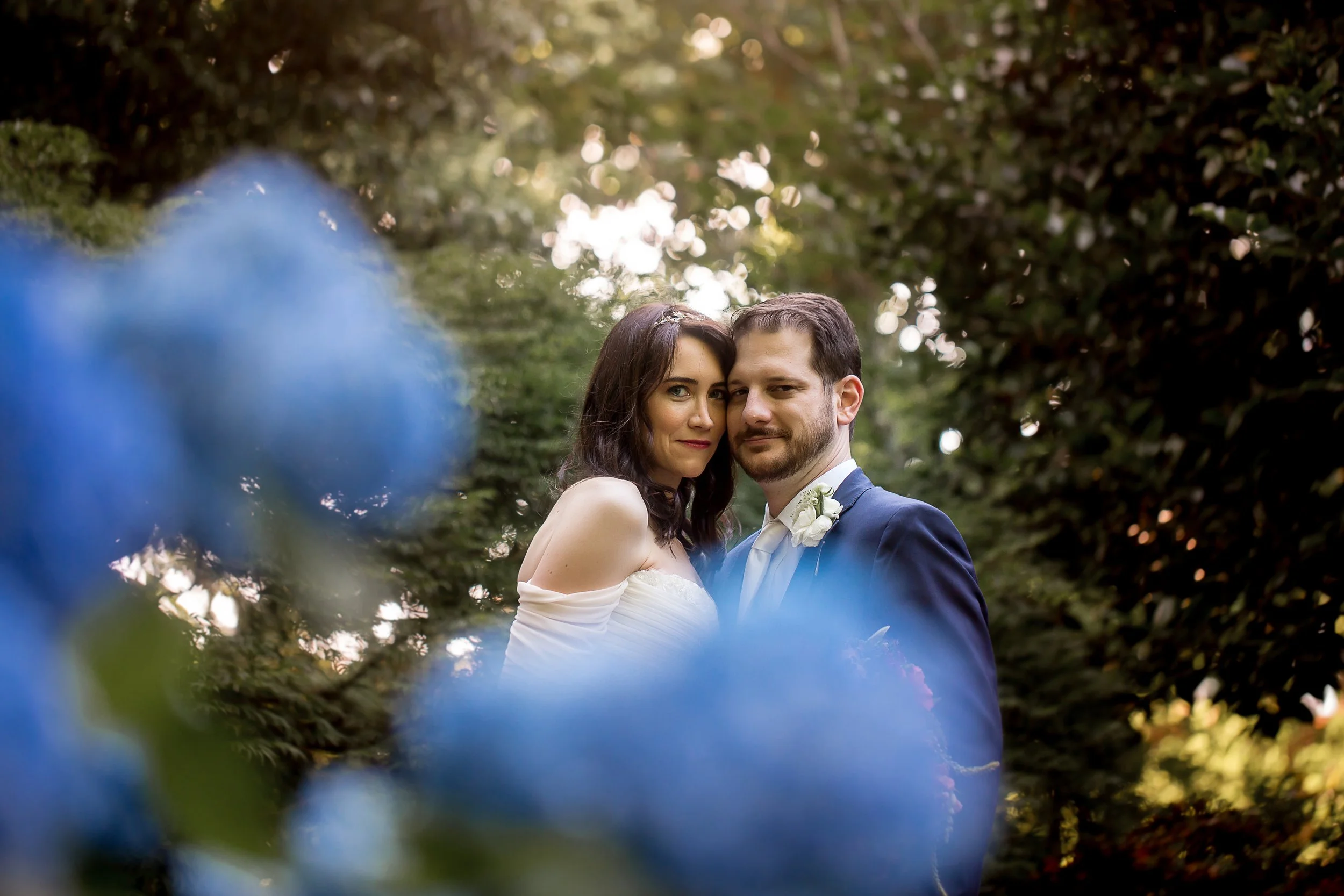 bride and groom in blue hydrangea flowers intimate elopement in charlotte nc