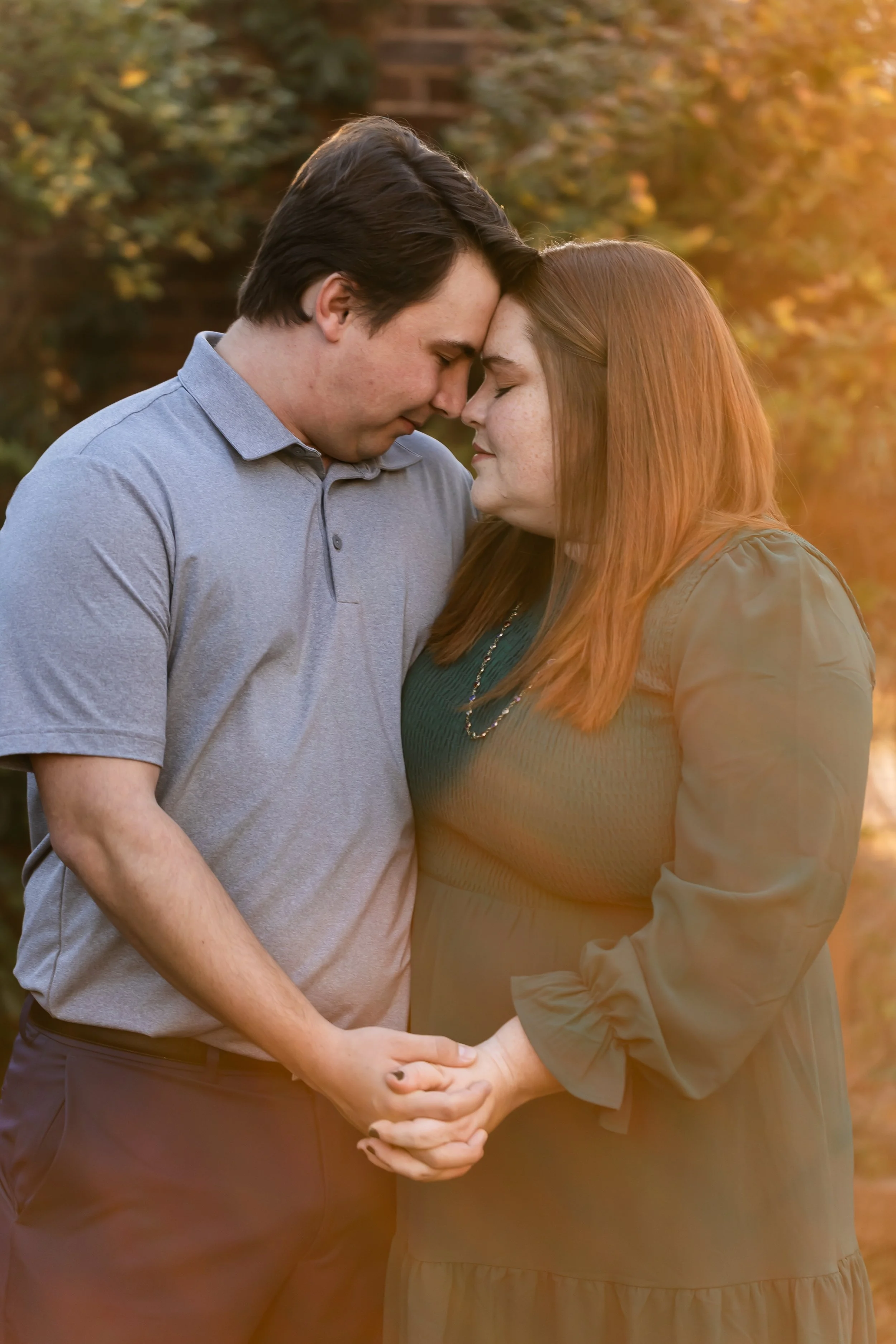 couple embracing warm winter sun plus size bride red hair