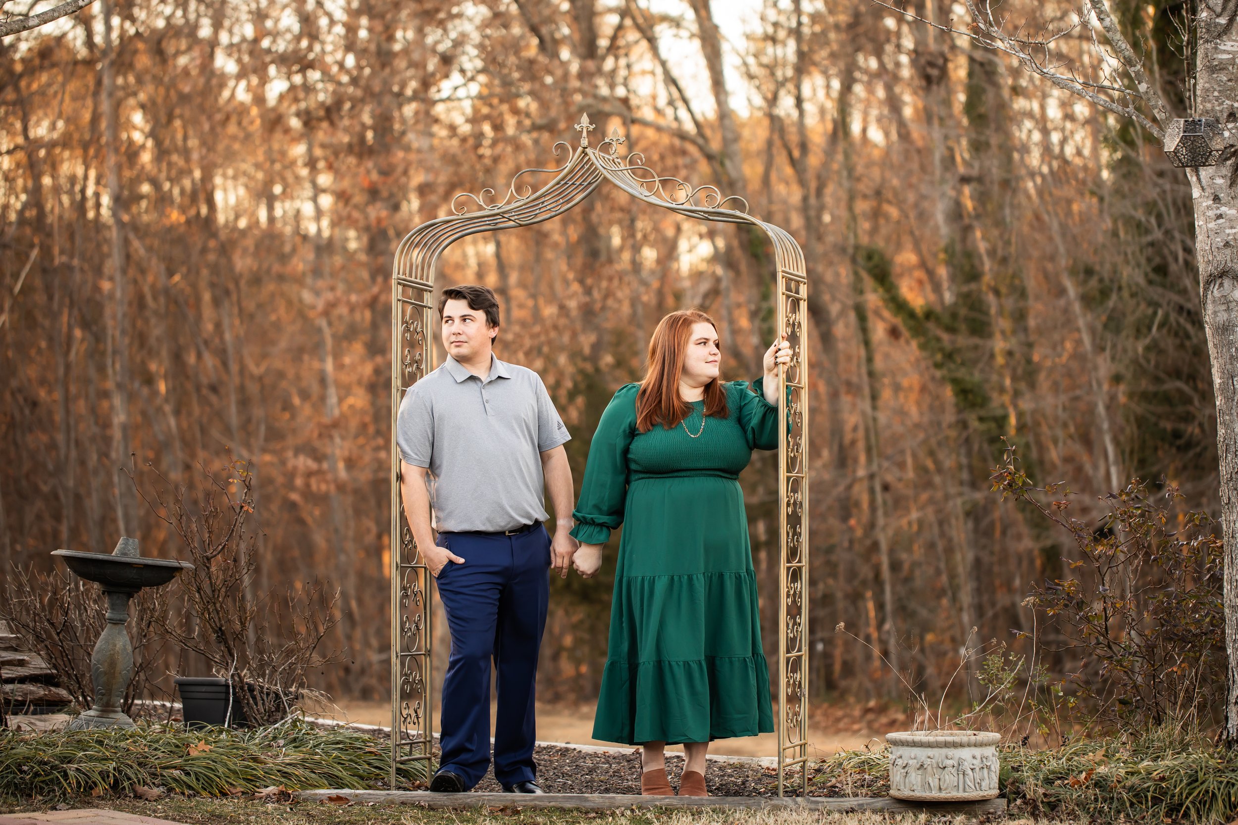 winter engagement session magnolia woods huntersville nc couple posing in arbor