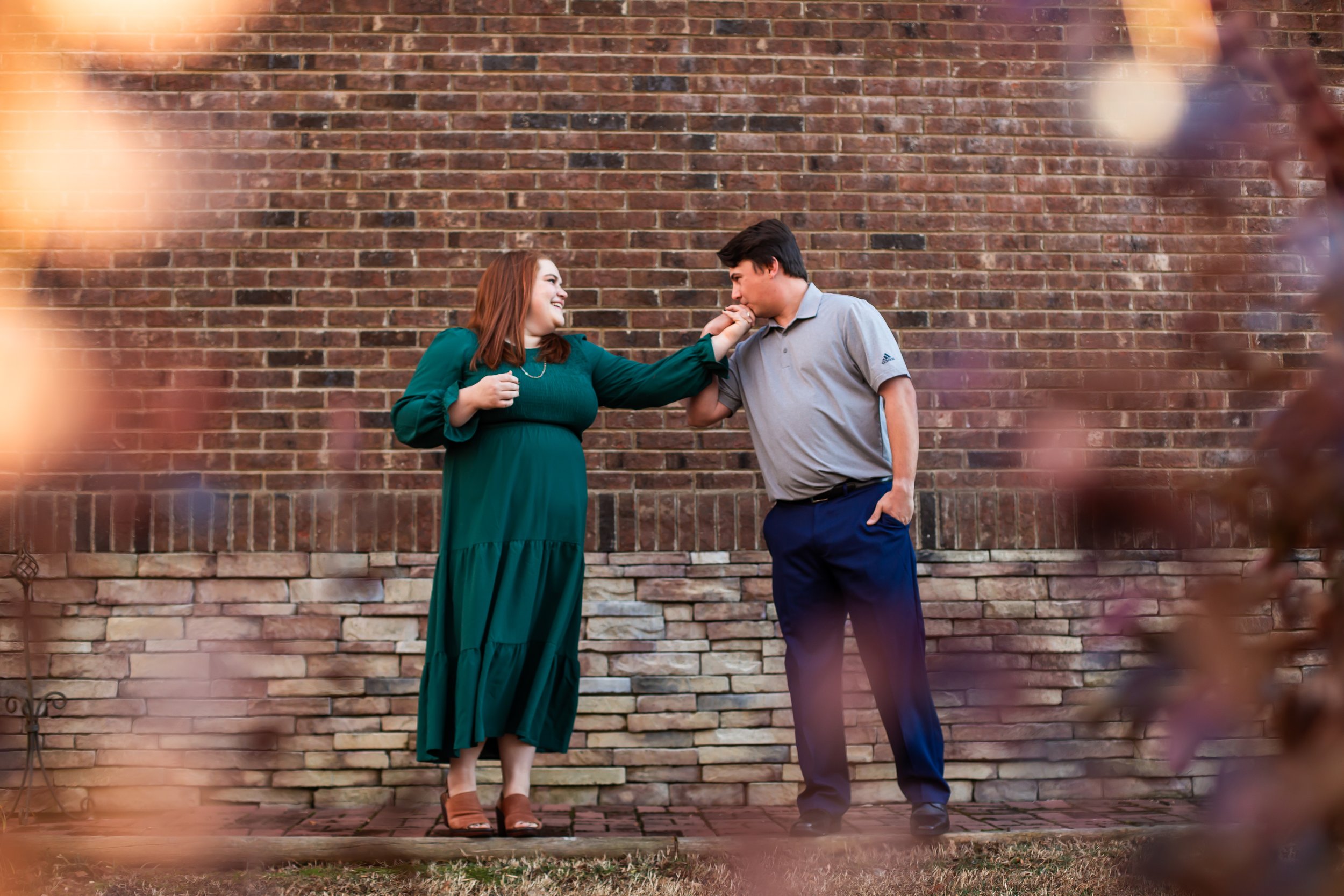 man kisses womans hand engagement session charlotte nc
