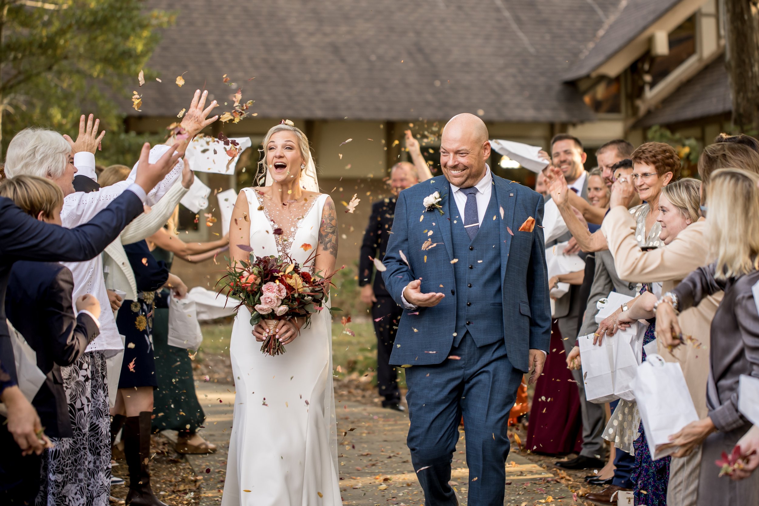 bride and groom celebrate after their ceremony with friends and family
