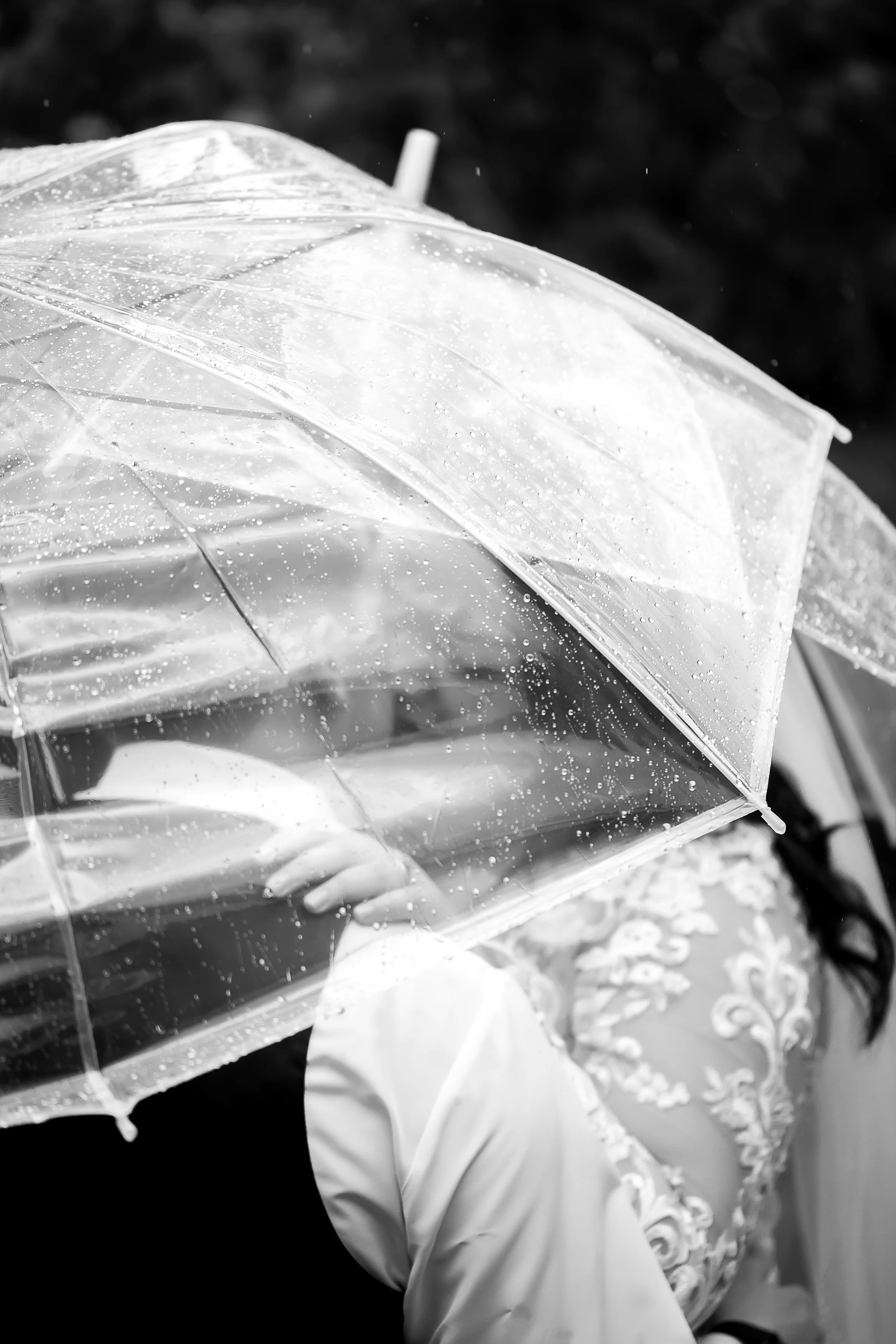 rainy clear umbrella on a wedding day rain