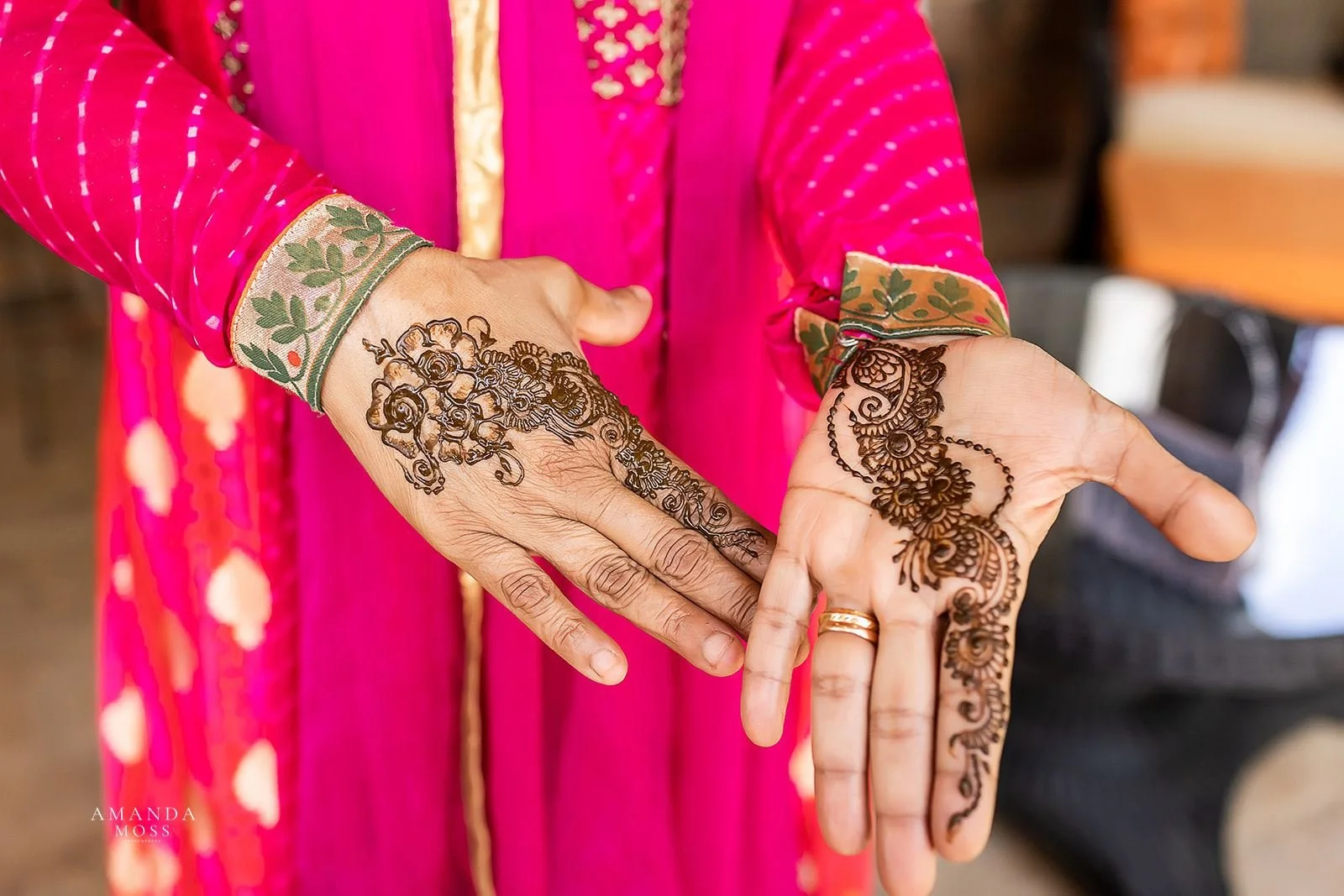  woman shows off henna on hands for indian wedding 