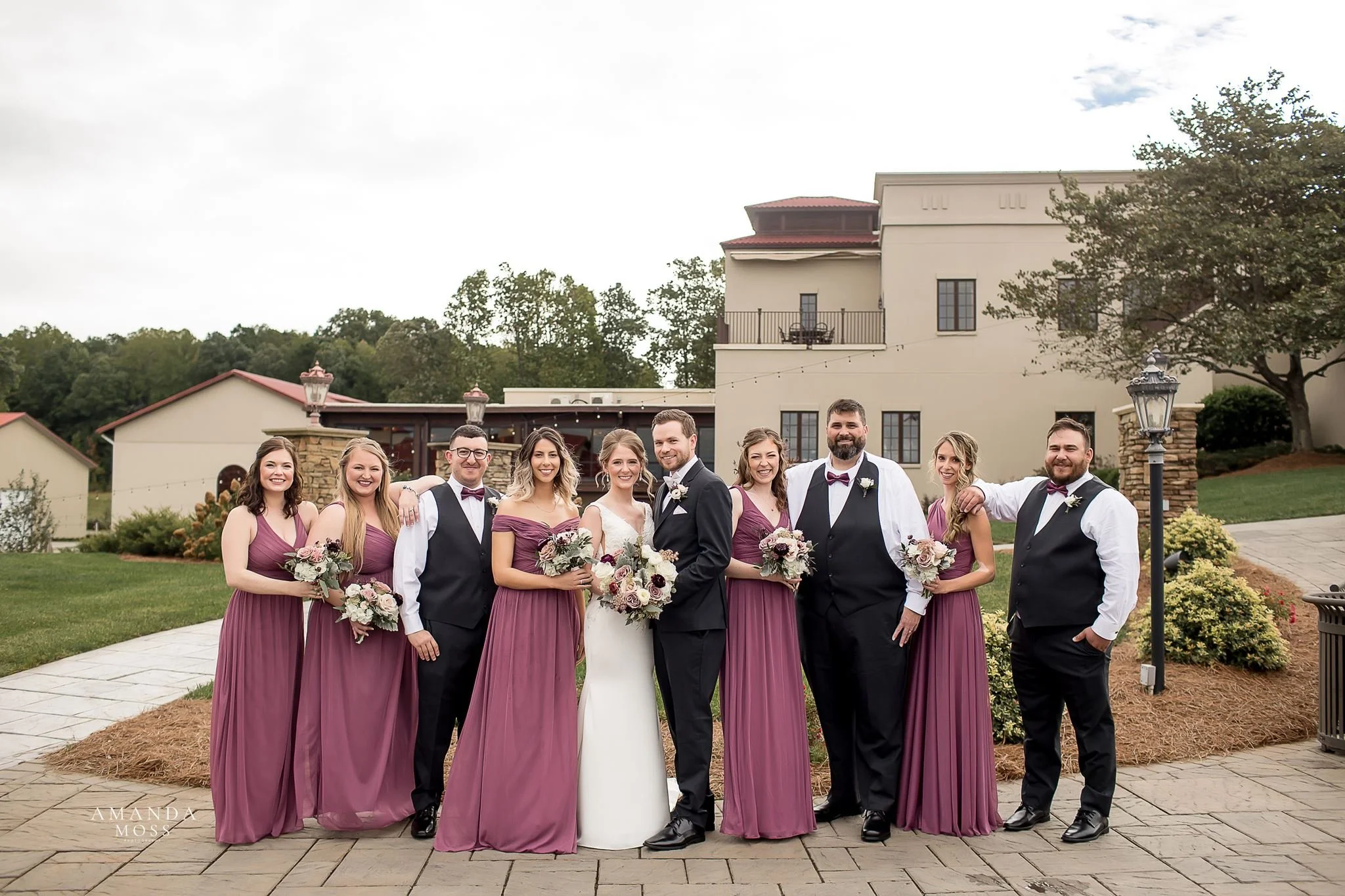 wedding party poses for photo outside of childress vineyards