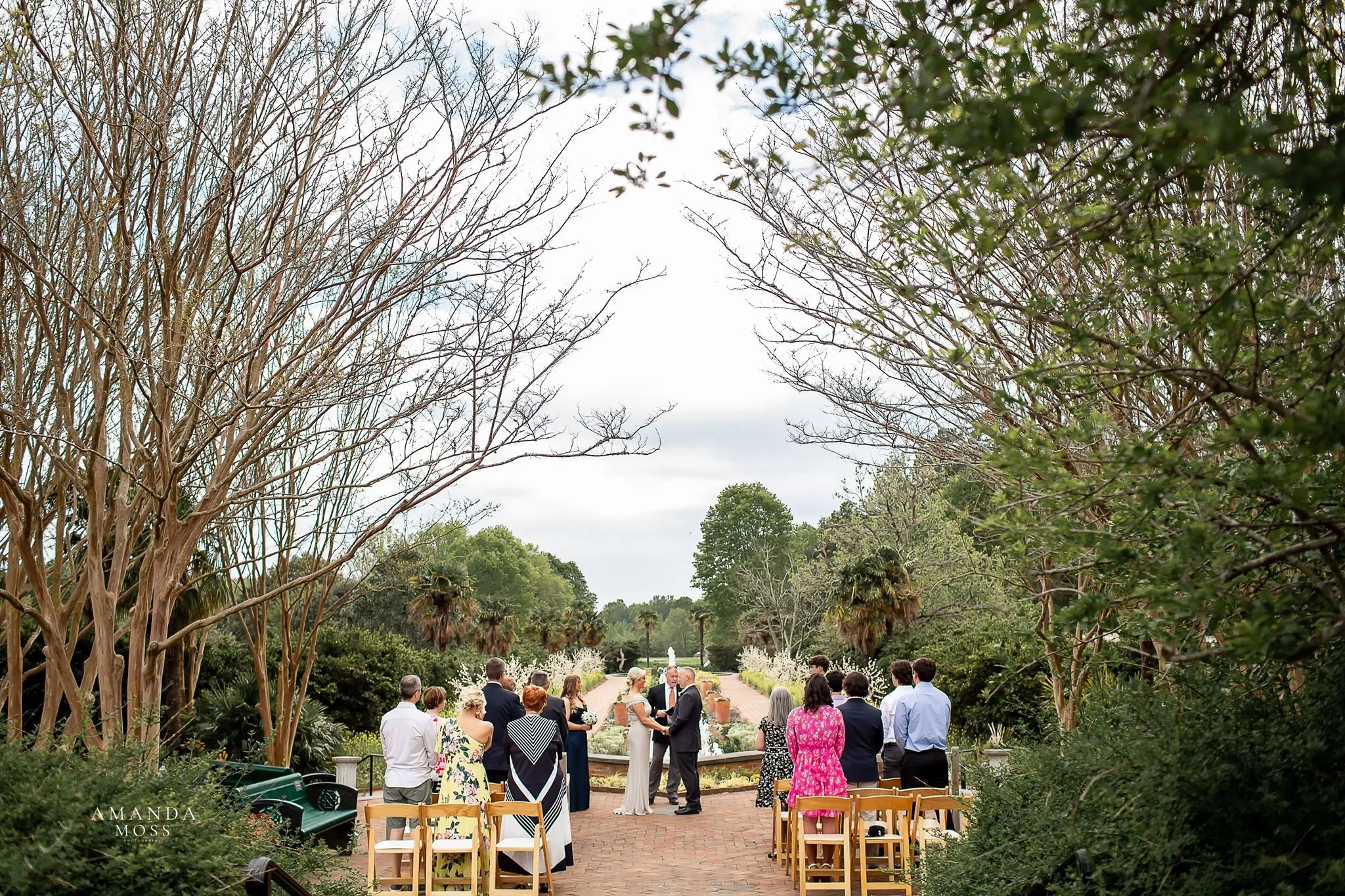 outdoor wedding ceremony in front of fountain at daniel stowe botanical garden stowe conservancy belmont nc