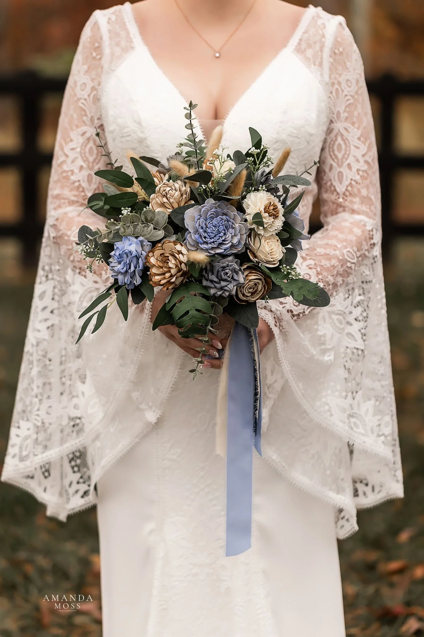 close up of brides dress and bouquet at outdoor wedding at bansen farms north carolina