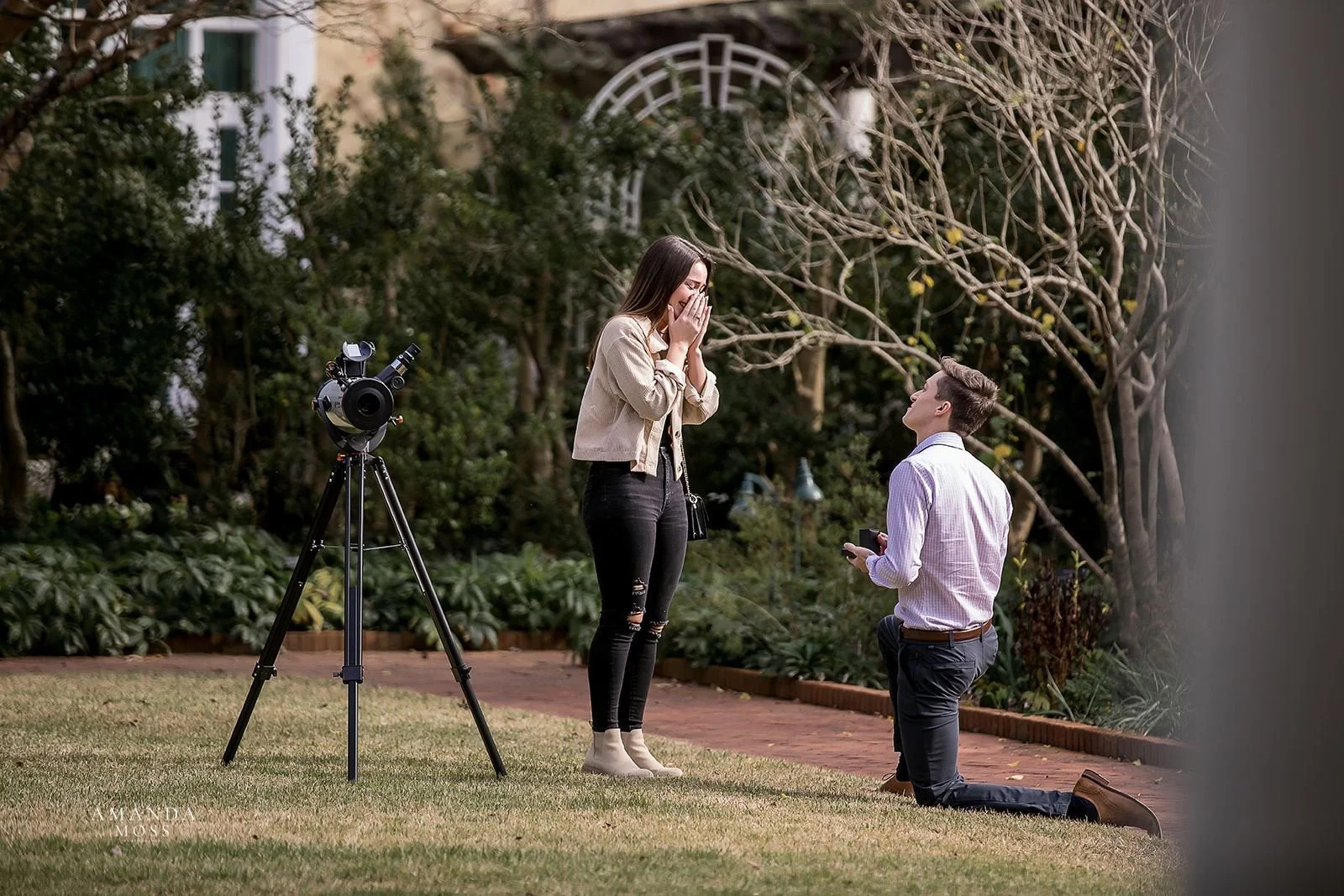 woman reacts to man proposing to her in garden at stowe conservancy