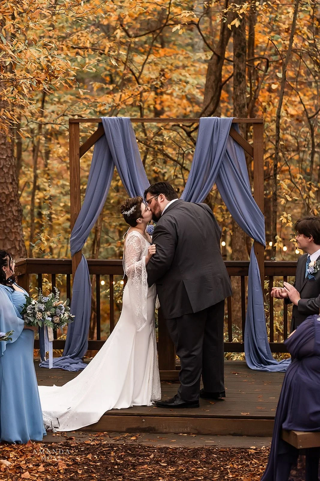 bride and groom kiss at wedding ceremony at bansen farms north carolina