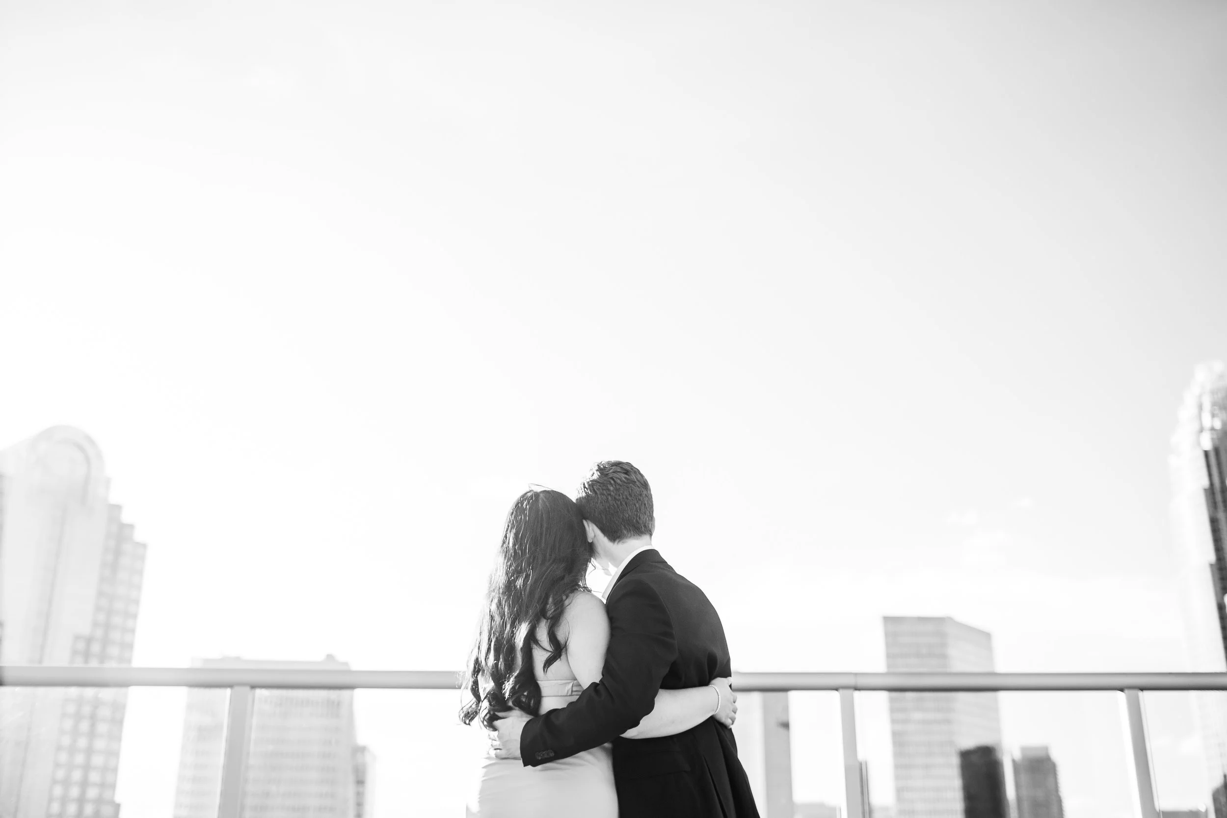 charlotte skyline black and white photo of couple looking into distance