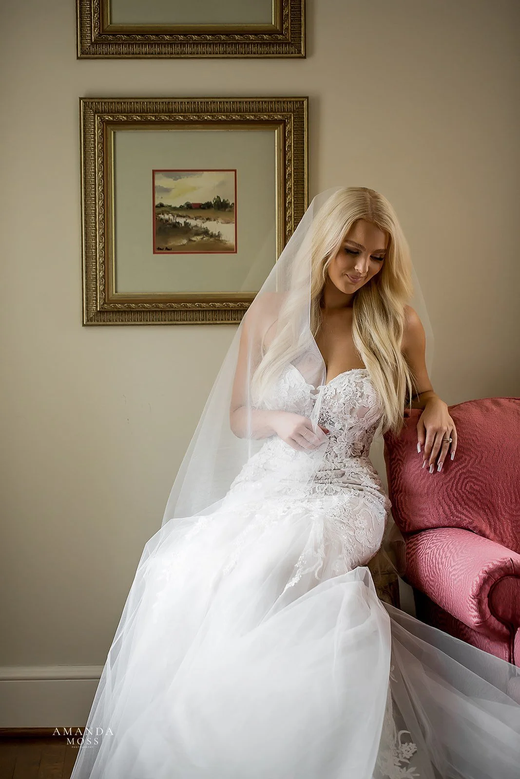 bride rests against chair as she prepares for her wedding in charlotte nc