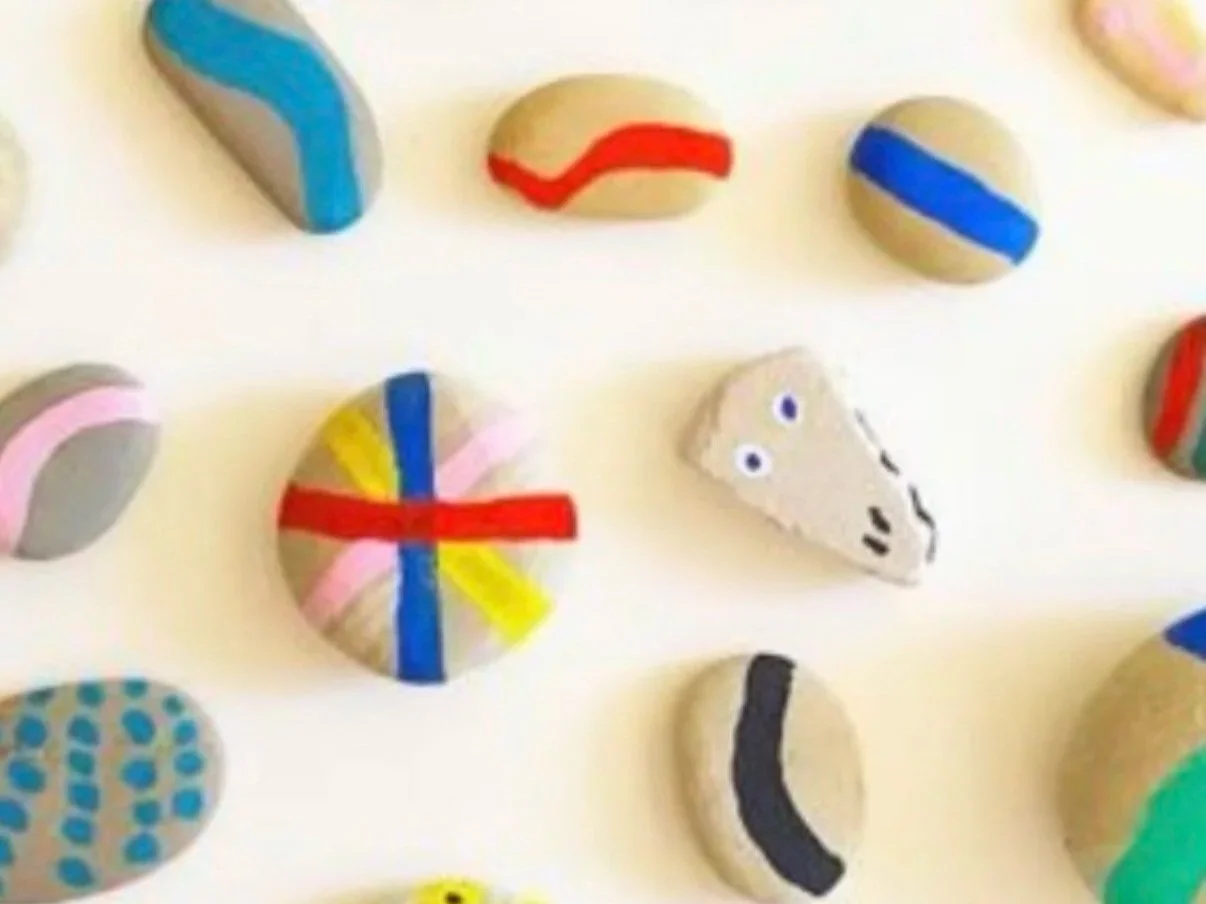 My lock screen is an image of painted rocks. Nature and art together is an especially happy place for me.
Each rock begins as something ordinary—weathered, permanent, shaped by time. Then someone chooses to see it differently. A little paint. A littl