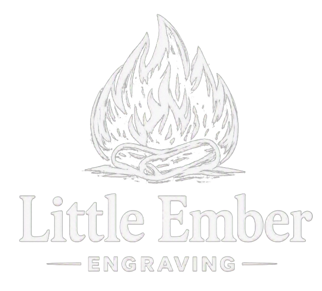 Logo of Little Ember Engraving featuring a stylized campfire with flames above intertwined logs.