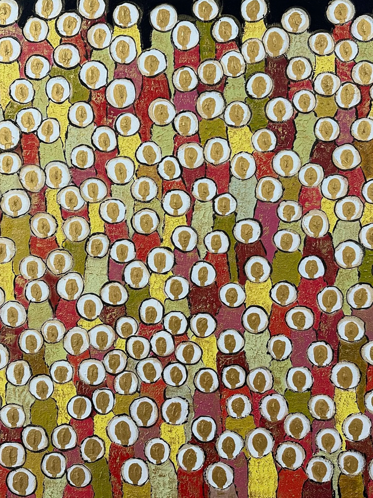 Pattern of small circles with faces in a colorful, textured background in yellow, red, green, and black.