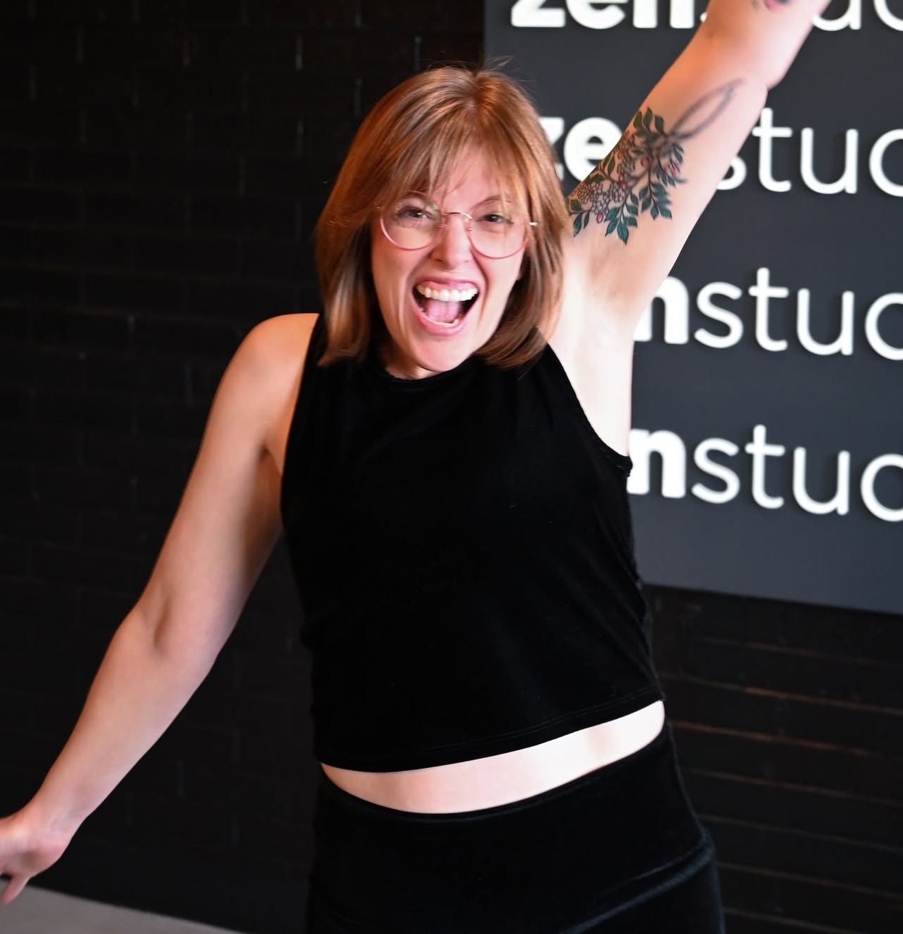 Instructor and manager, Leah Hyneman smiling and excited.