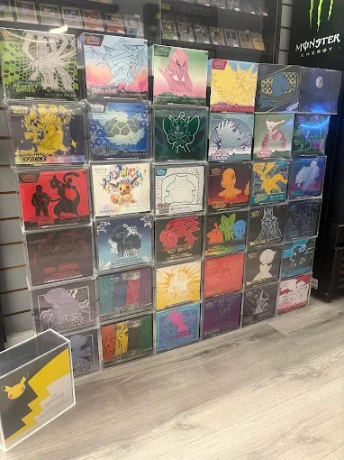 Display of Pokémon-themed merchandise with various colorful and stylized Pokémon designs in plastic cases on a store shelf.