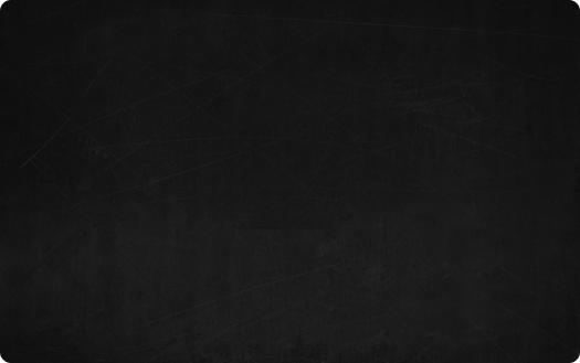 Blackboard with faint chalk marks and scratches.