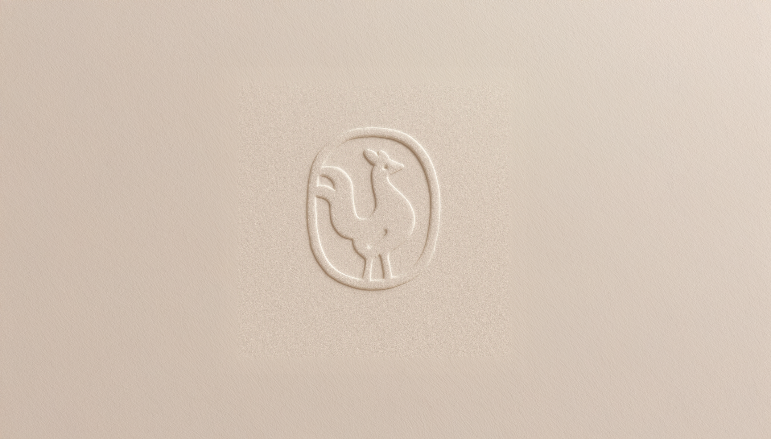 Embossed logo of a stylized animal, possibly a giraffe, inside an oval on a light cream surface.
