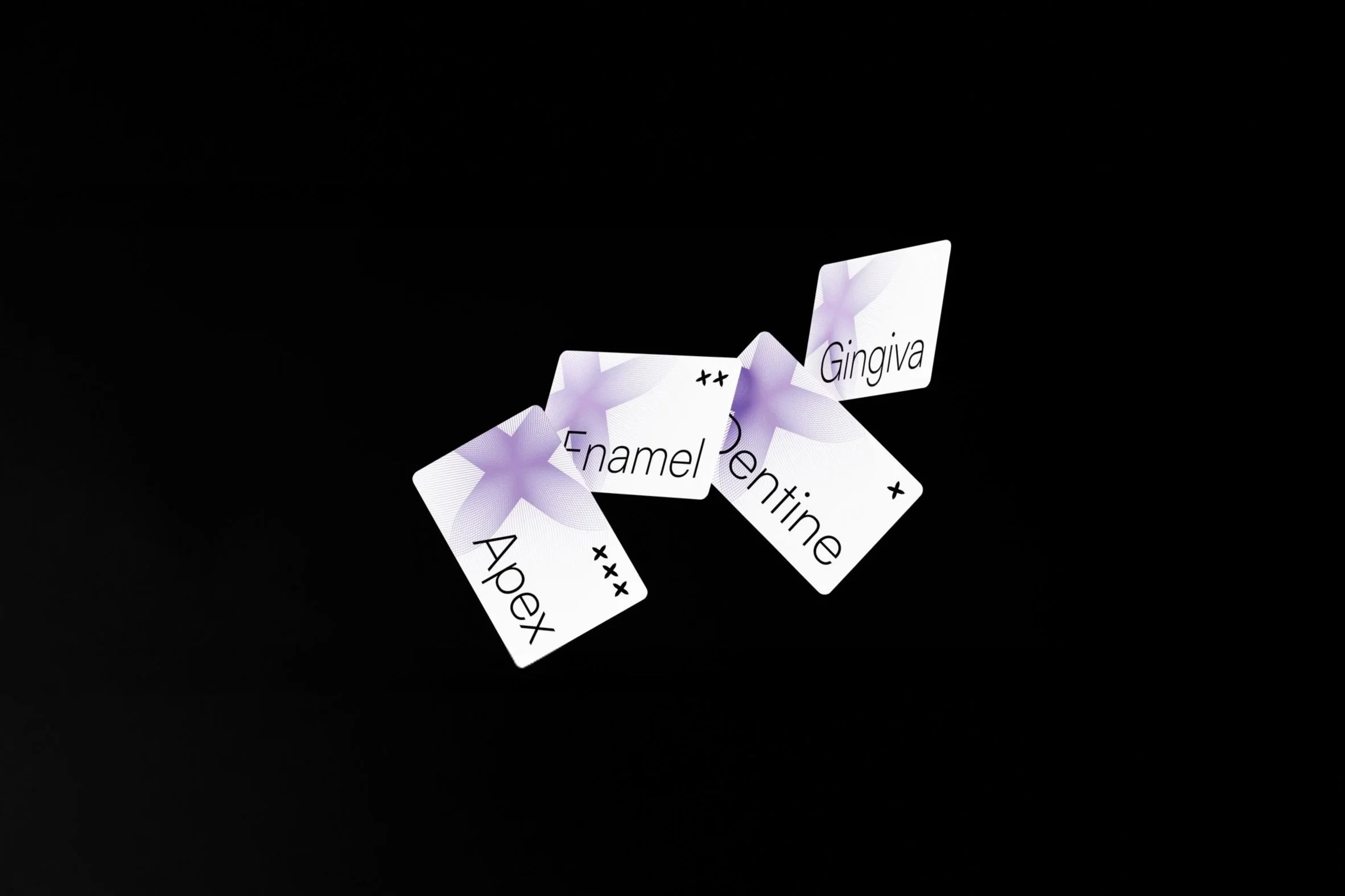 Falling playing cards with words like "Gingiva," "Enamel," and "Apex" on a black background.