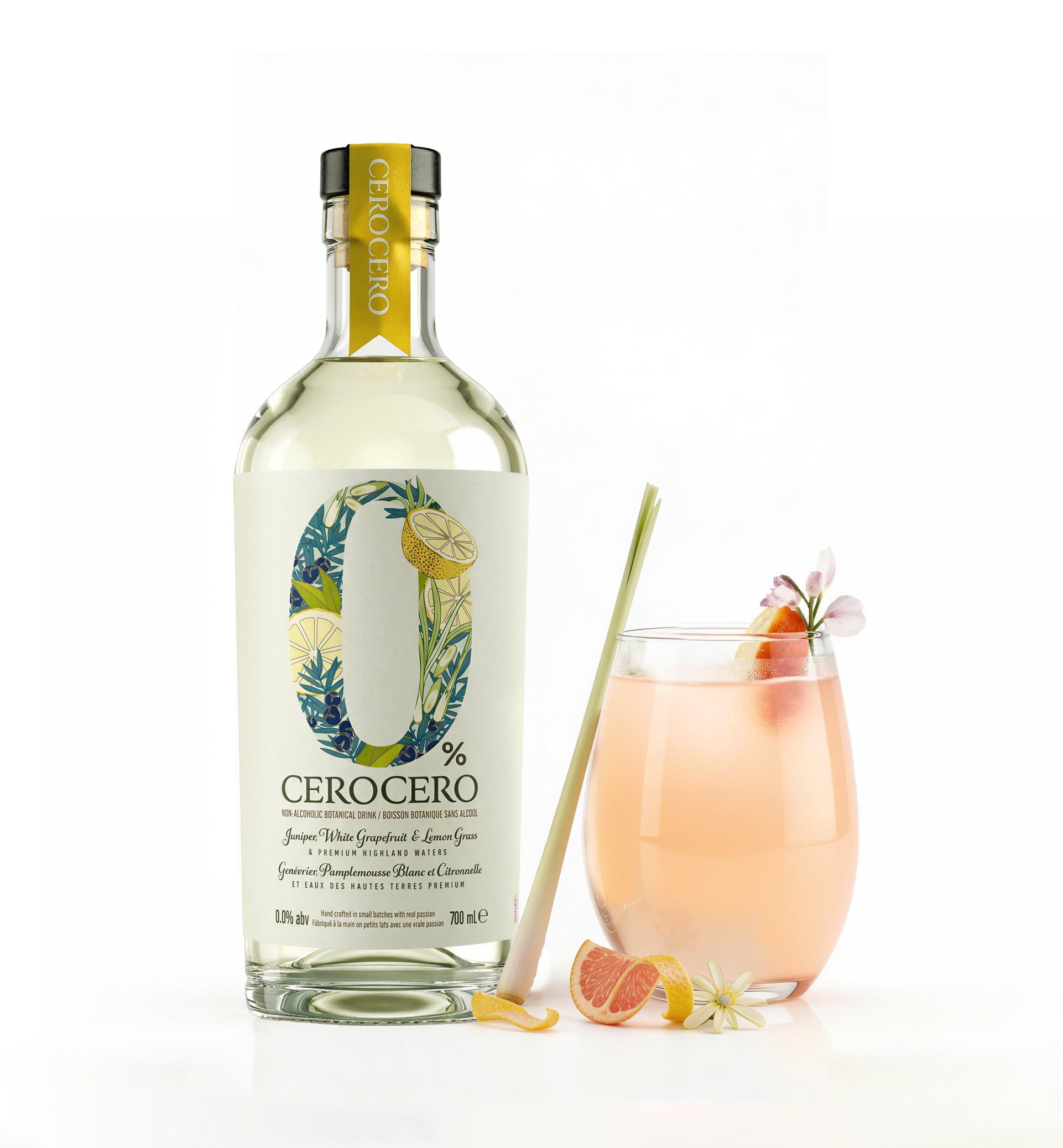 Bottle of Cerocero non-alcoholic botanical drink with citrus and floral illustrations on the label, a glass of pinkish beverage garnished with flower, grapefruit, lemon, and pink flower, and a straw against a white background.