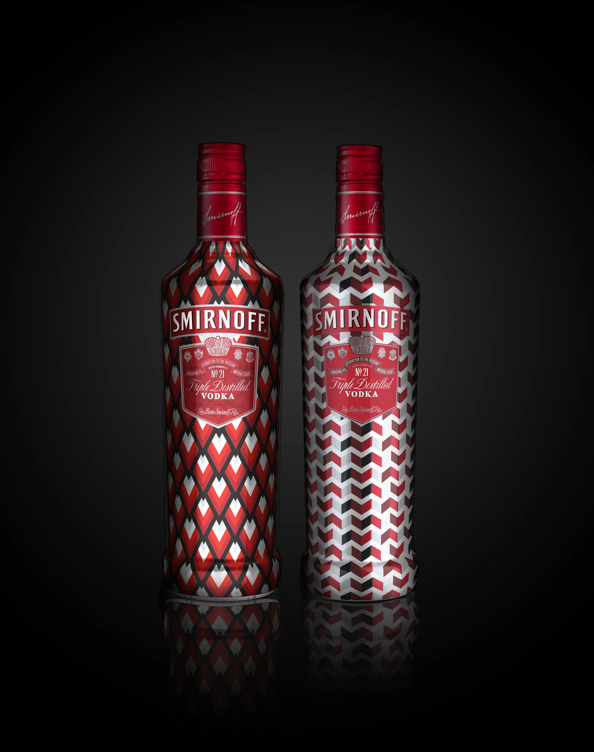 Two bottles of Smirnoff vodka with patterned labels, standing against a black background with a slight reflection