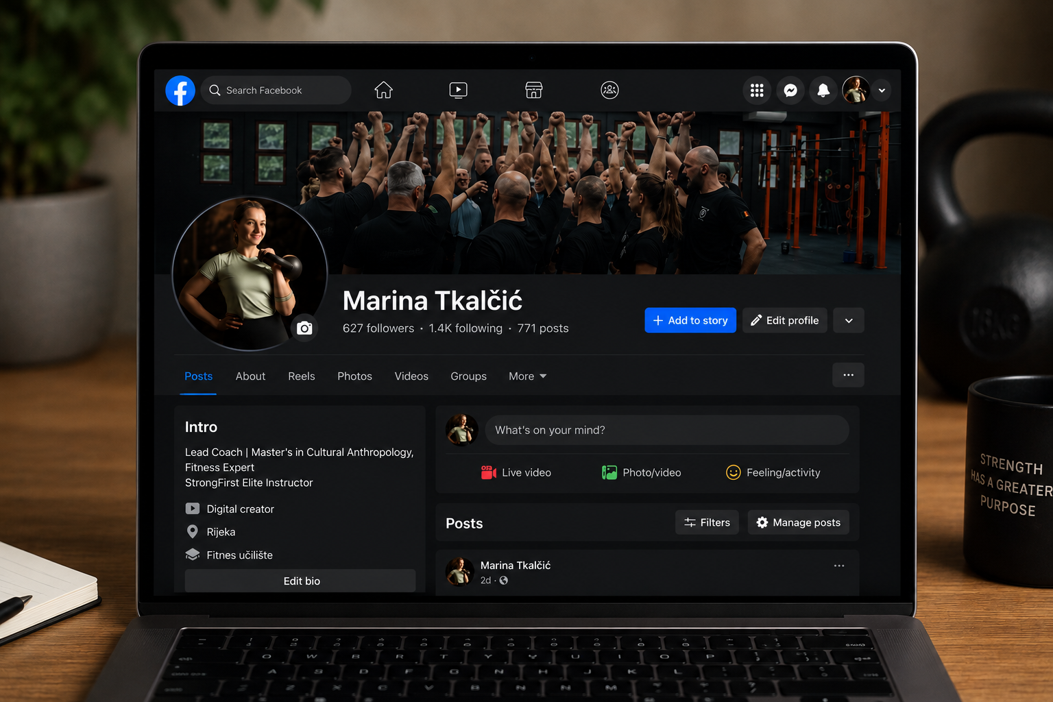 Facebook profile page of Marina Tkalčić, showing a cover photo of a group of people with their fists raised and a profile photo of a woman holding a kettlebell, with a wooden desk, notebook, pen, plant, and mug in the background.