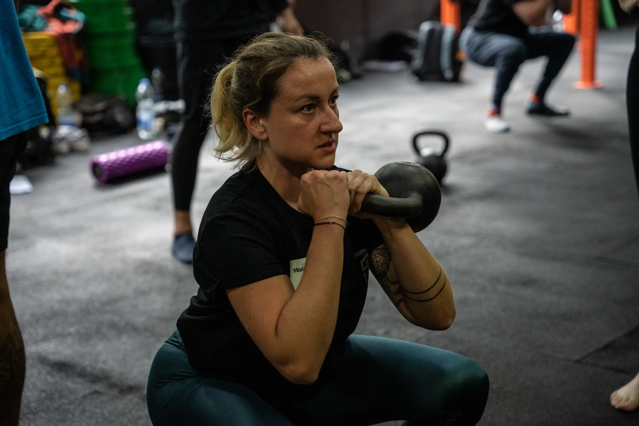 Marina Tkalčić, StrongFirst Elite Instructor and founder of Strength Studio Marina, performing a squat at the StrongFirst certification.