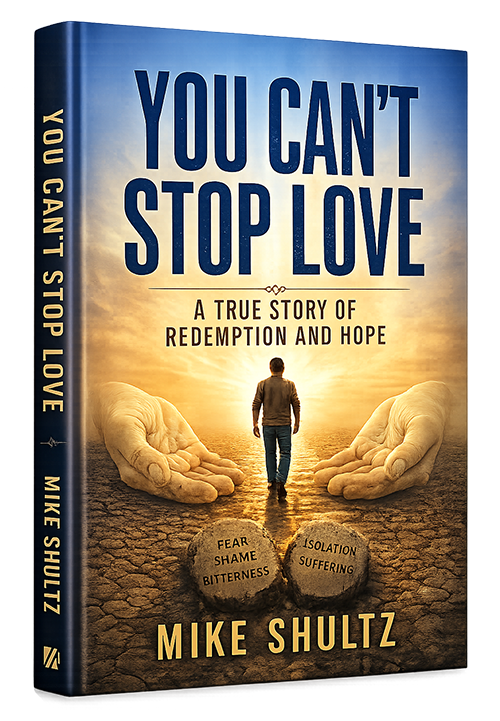 Cover of You Can't Stop Love: A True Story of Redemption and Hope by Mike Shultz, featuring a man walking between outstretched hands toward a bright horizon.