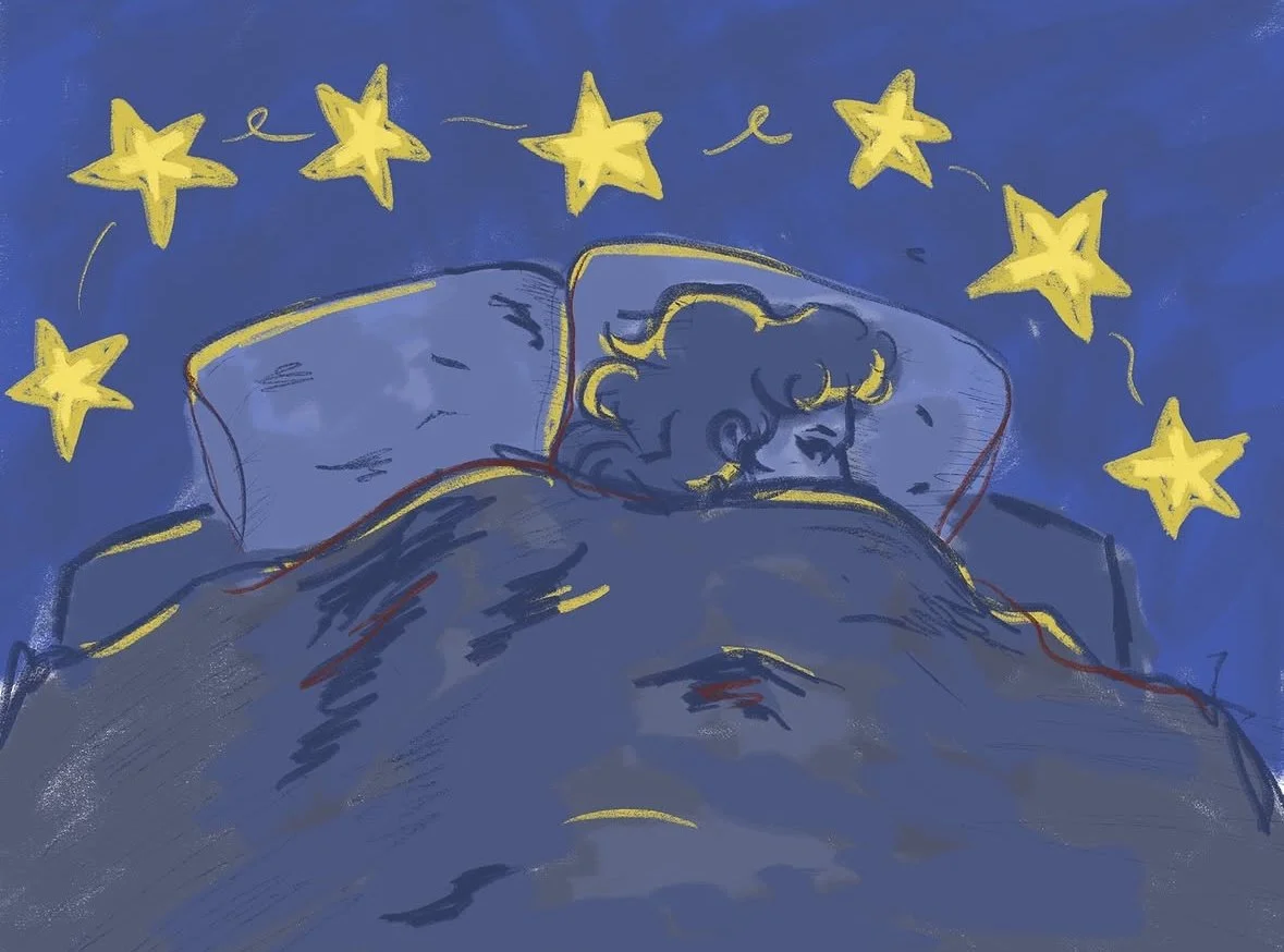 Sleeping peacefully in bed with stars hanging above. Blue and yellow lighting