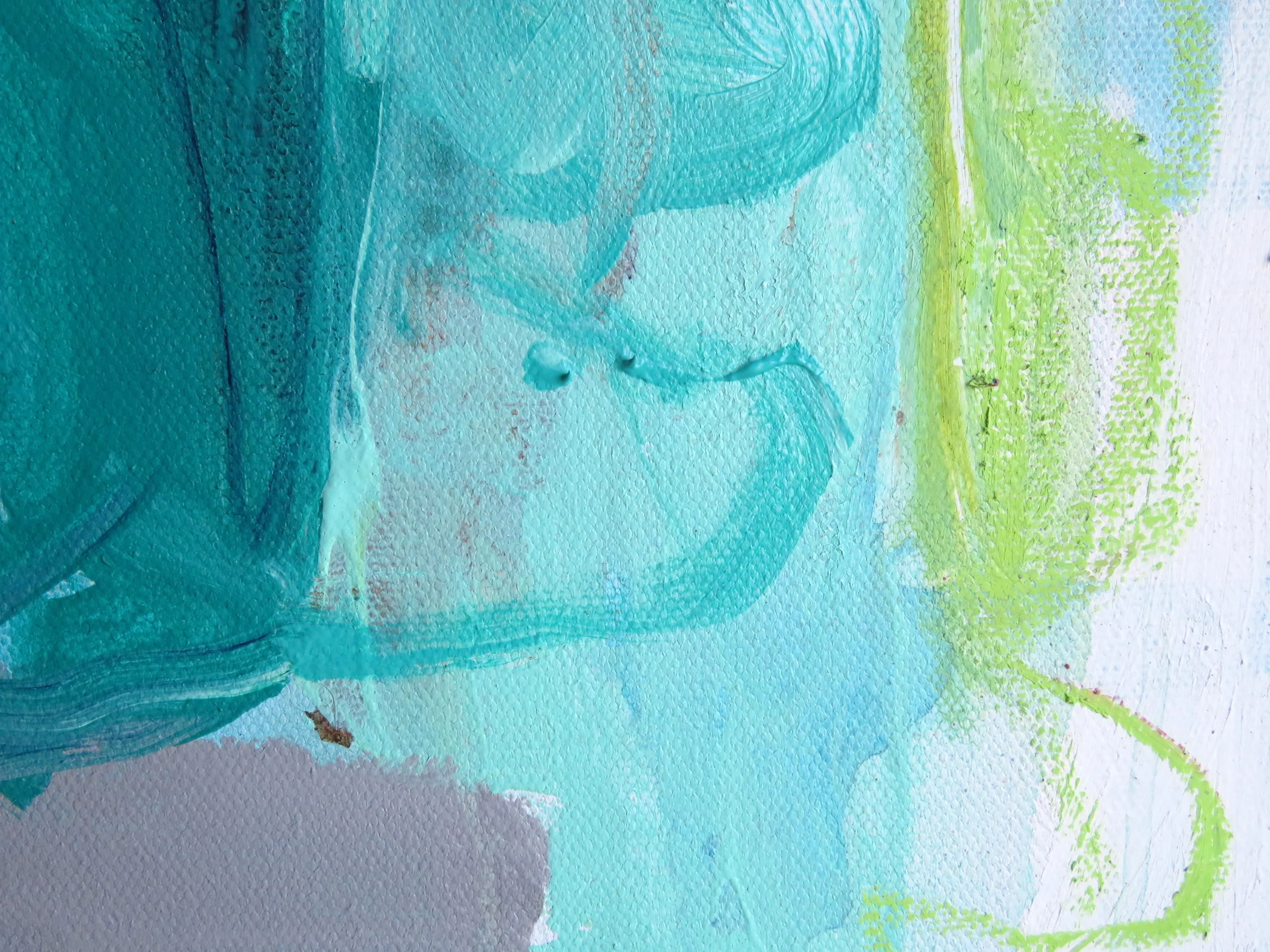 Close-up view of an abstract watercolor painting with shades of blue, green, and hints of purple and brown.