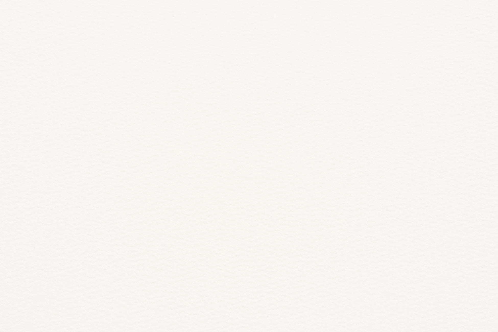 Blank white paper on a textured surface.