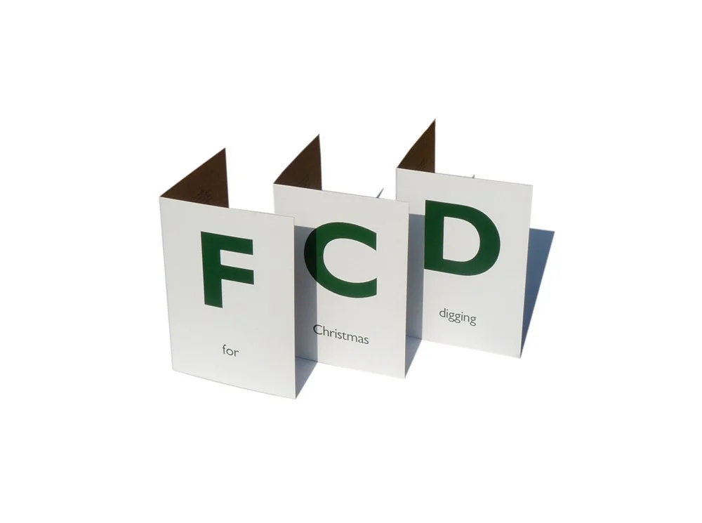 Holiday greeting card with large green letters F, C, D and smaller text 'for Christmas digging'.