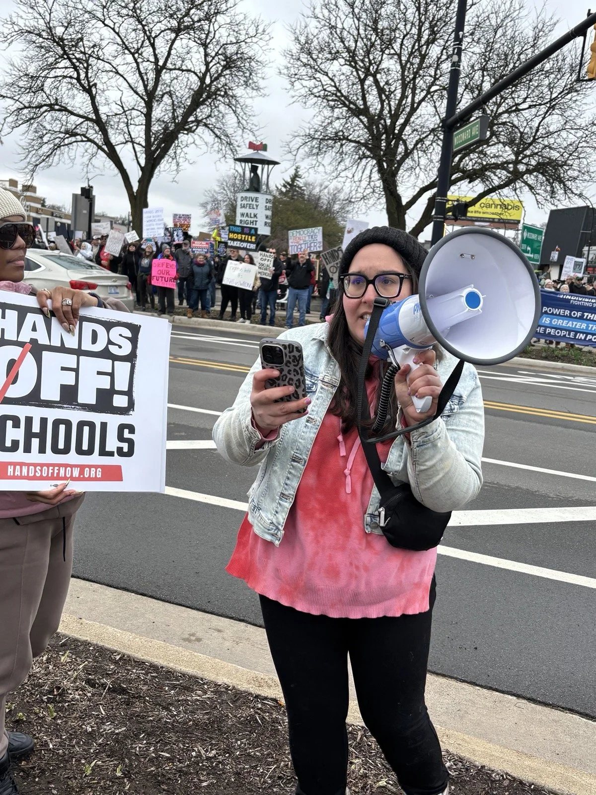 Jessica speaking into a bullhorn at the Ferndale No Kings protest