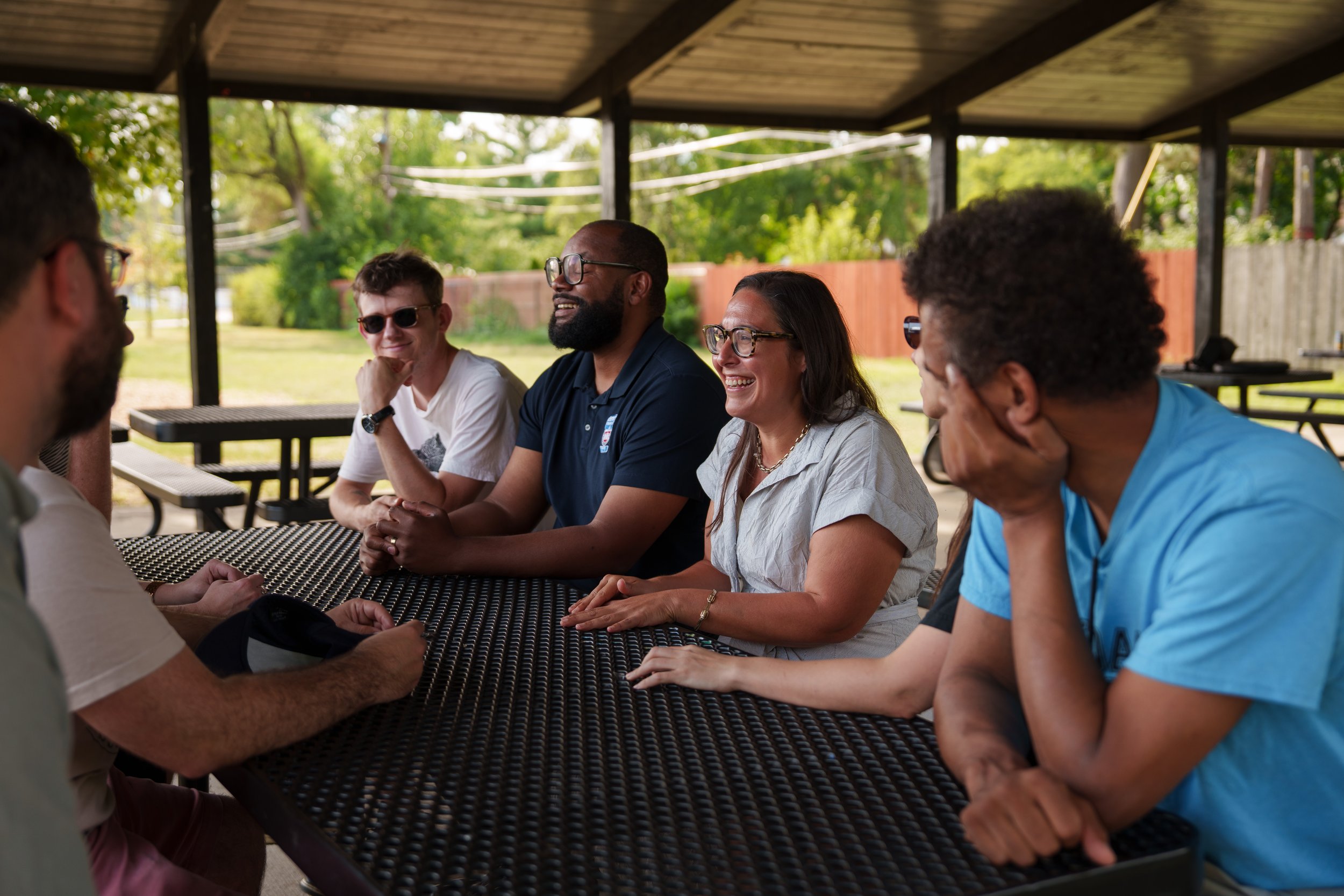 Jessica laughing with a group of Ferndale residents in a pavilion