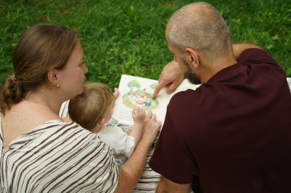 Parents reading to their child