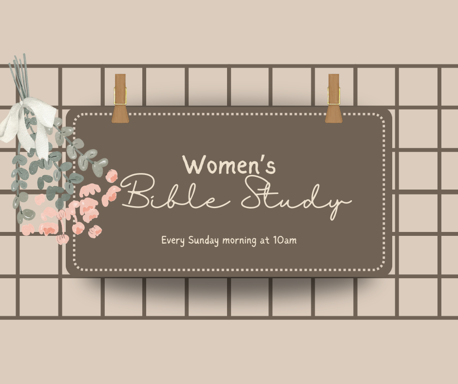 A sign for Women's Bible Study hanging on a grid, decorated with pink and gray floral accents and a white bow.