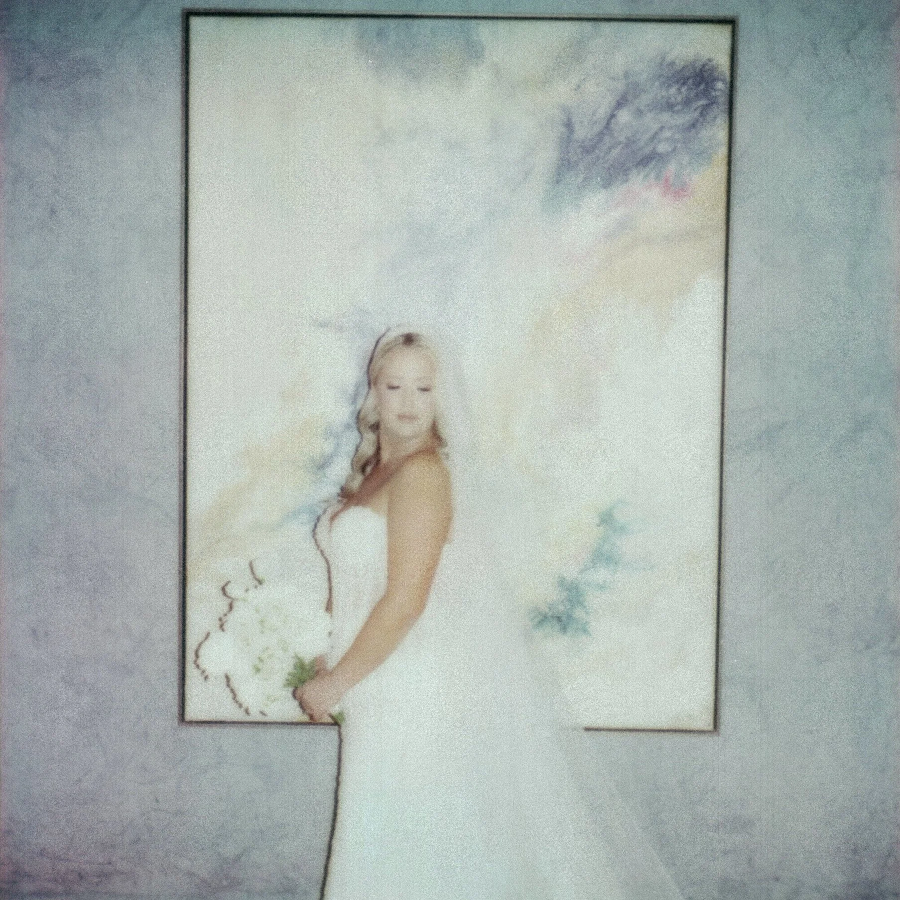 Poster featuring a woman with long blond hair, wearing a white dress, with water and clouds in the background.