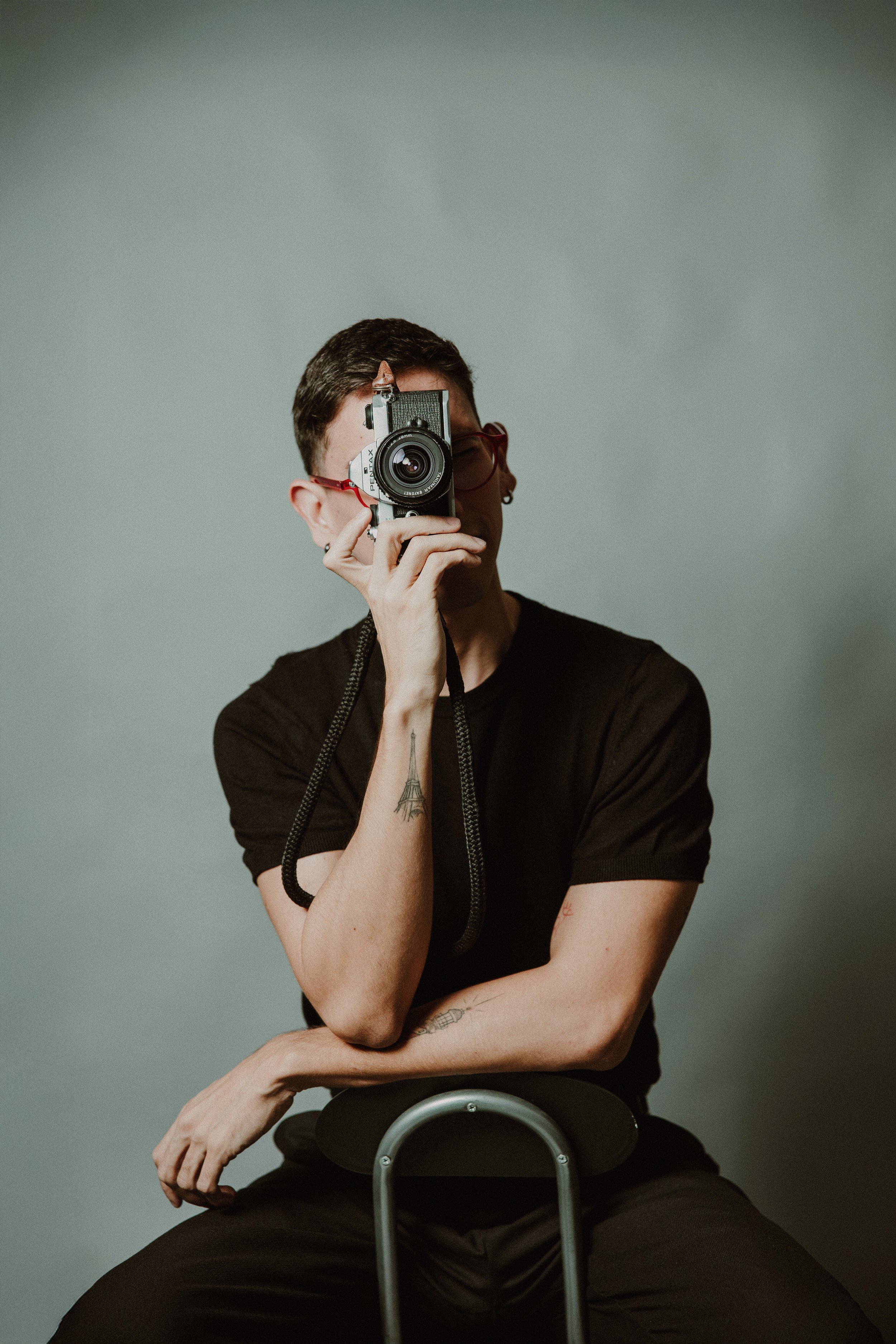 Portrait of Eduardo Paralizabal holding his first 35mm camera, 2026
