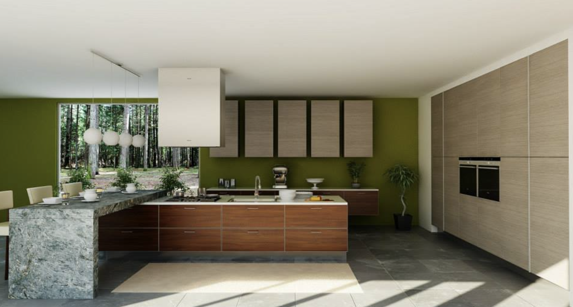 Cocina moderna con armarios de madera y pared verde, ventana con vista a un bosque con árboles altos, isla de cocina de granito con utensilios y plantas decorativas.