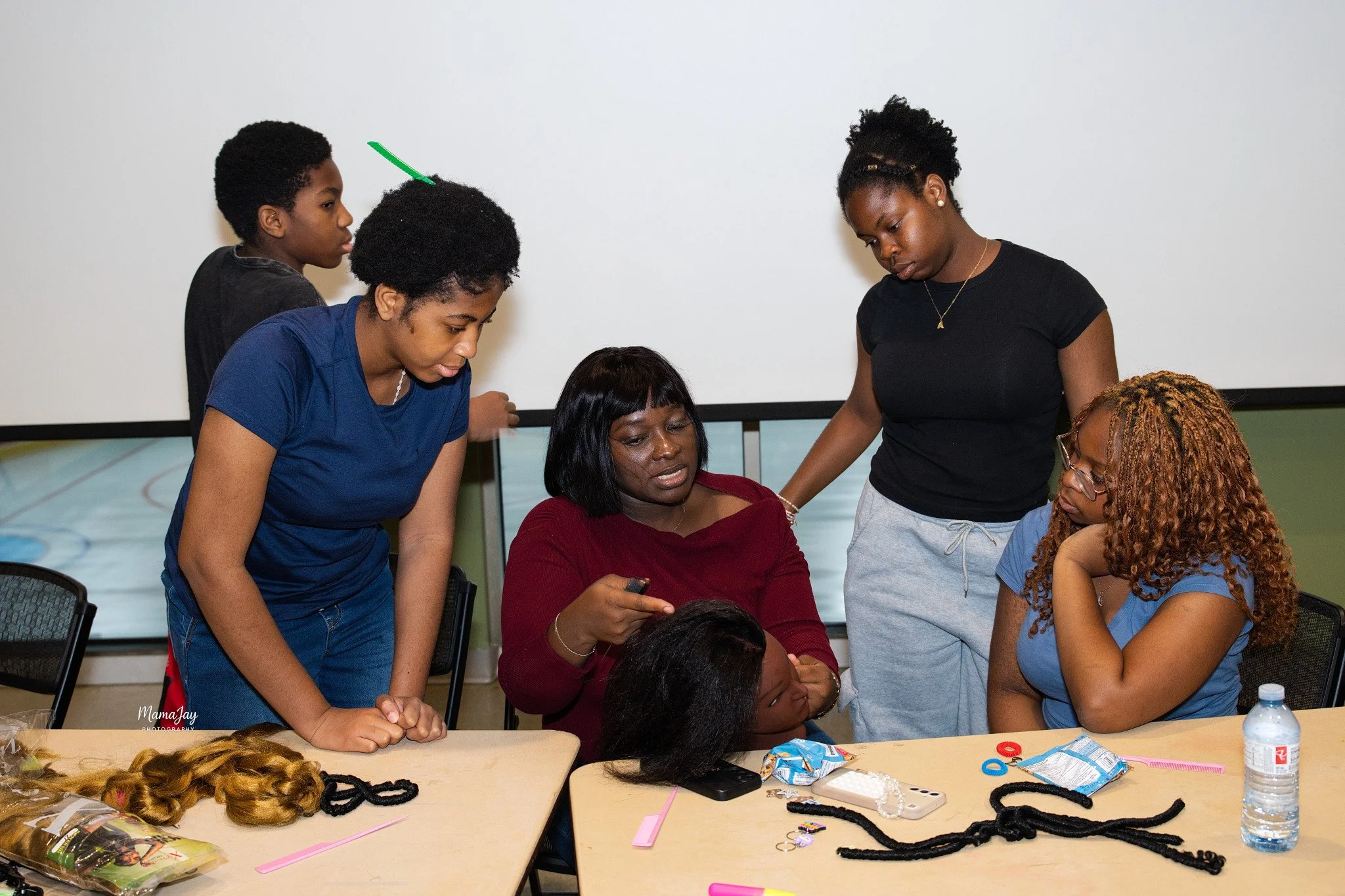 Hair by bloom teaching students