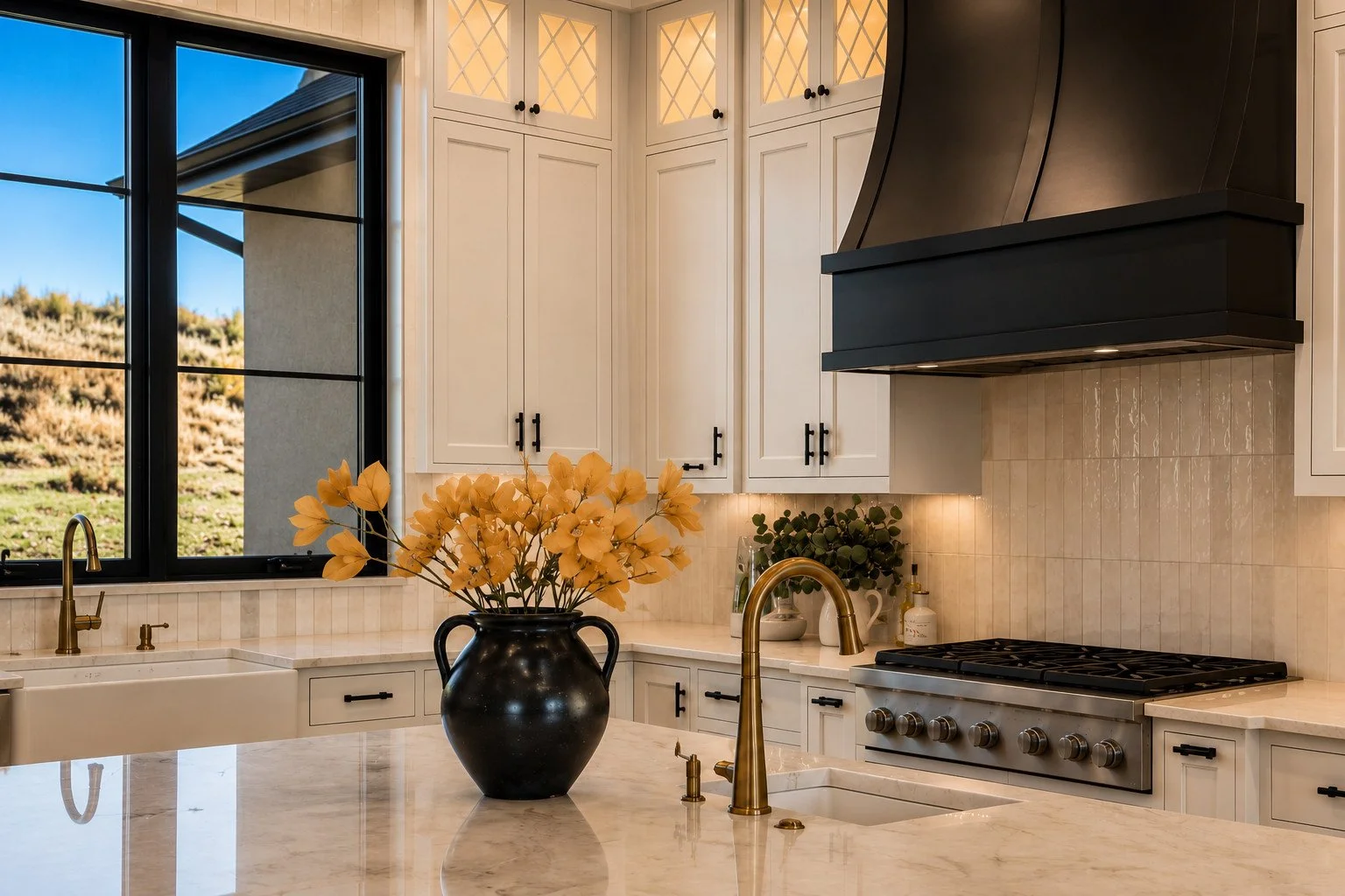 Kitchen with black range hood and marble island, Franktown, Colorado