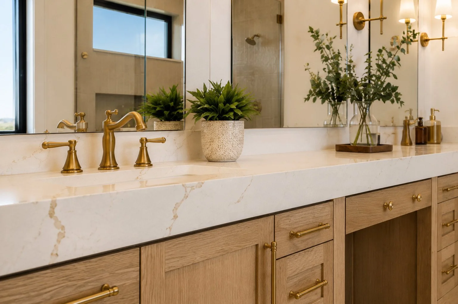 Bathroom vanity with brass accents and thickened edge marble countertop, Parker, Colorado