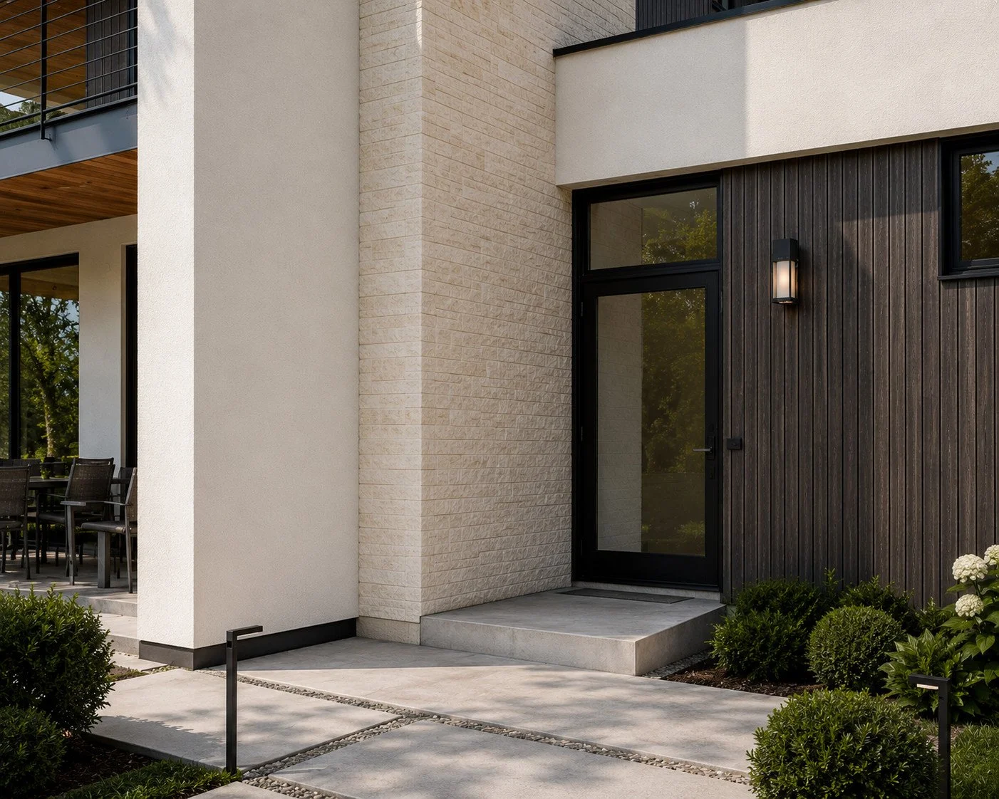 Modern custom home entry with black front door and architectural exterior lighting, Cherry Hills Village, Colorado