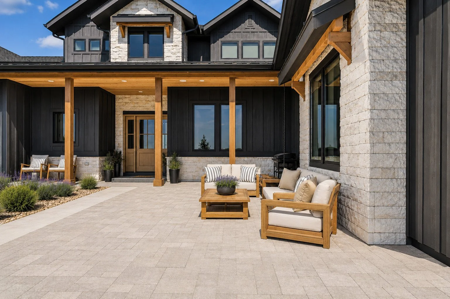 Exterior view farmhouse outdoor living area with charcoal siding, stone accents, timber porch and paver walkway, Parker, Colorado