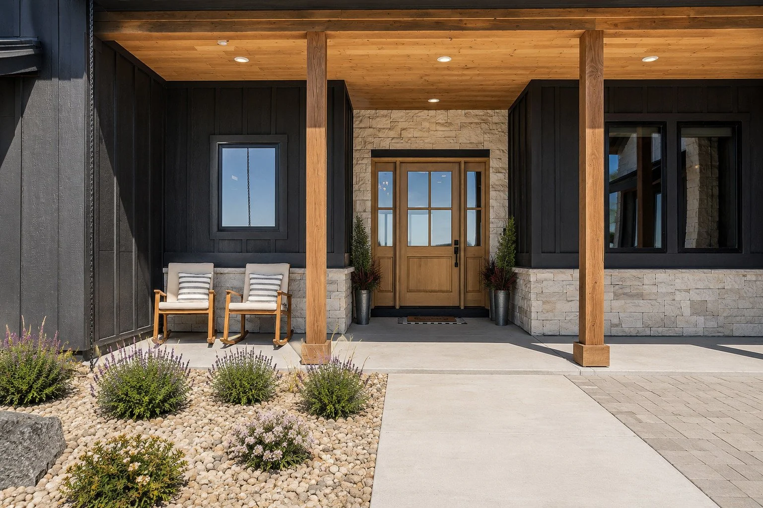 Custom covered front porch with timber detailing, natural stone and wood entry door, Parker, Colorado