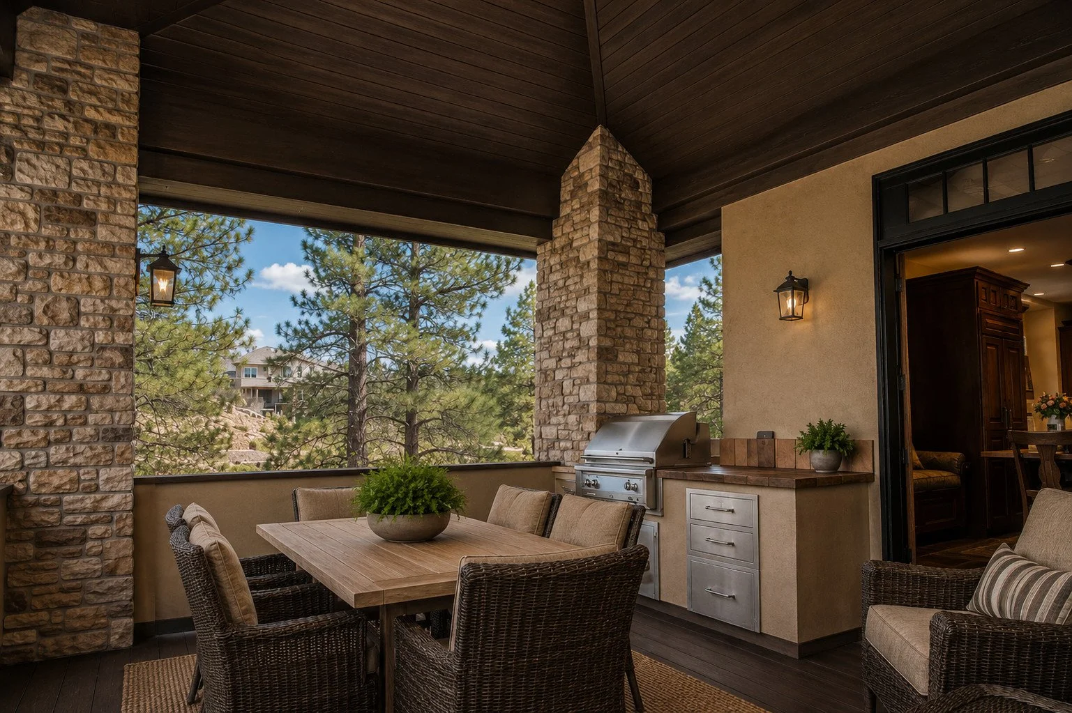 Outdoor kitchen and dining area with stone columns and timber ceiling, Castle Rock, Colorado
