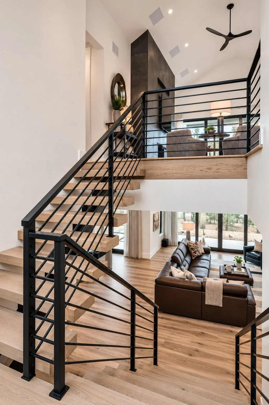 Two-story living room with floating steel staircase, Franktown, Colorado