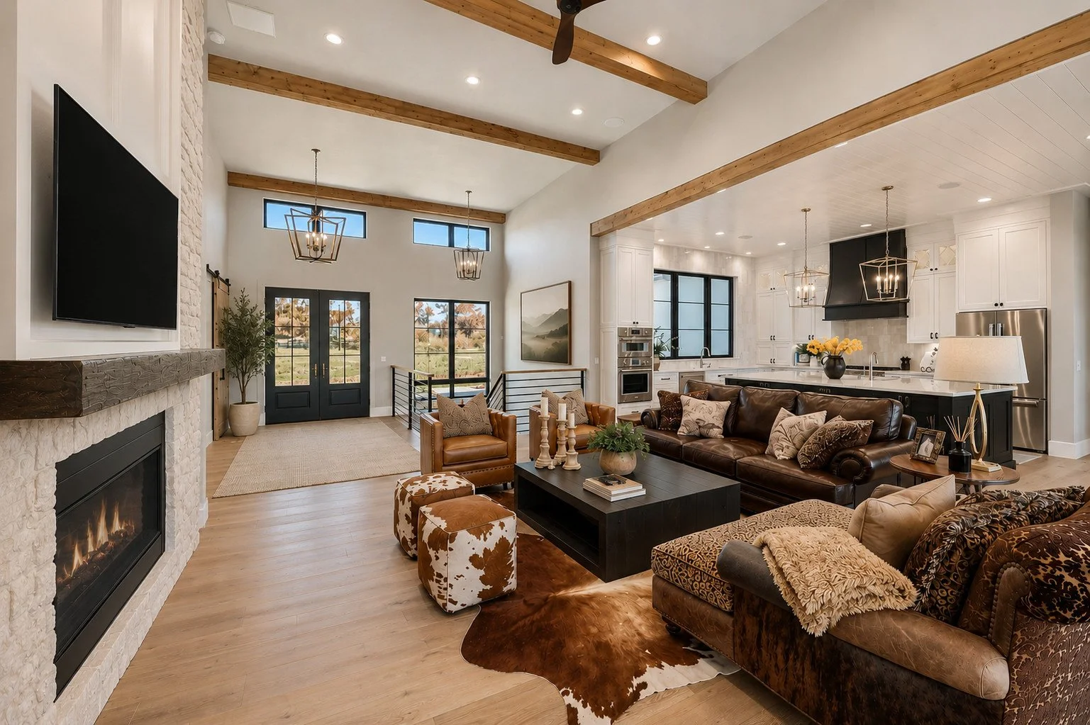 Open-concept living room with cowhide ottomans, farmhouse style, Franktown, Colorado