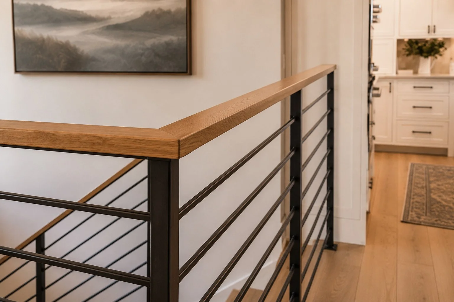 Staircase railing oak detail overlooking kitchen, Franktown, Colorado